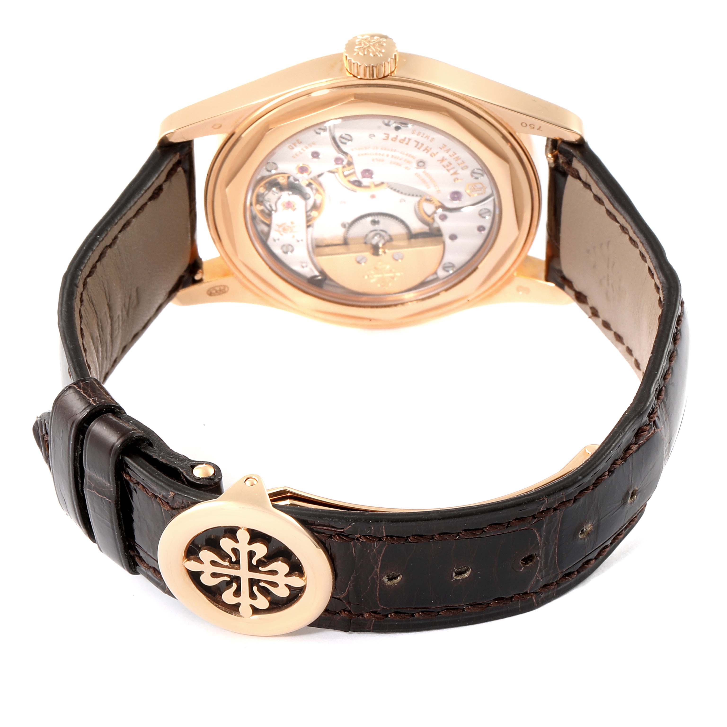 The image shows the back view of a Patek Philippe Calatrava 6000R Men's Rose Gold Brown Dial 6000R Men's Rose Gold Brown Dial watch, highlighting its leather strap and the transparent case back.