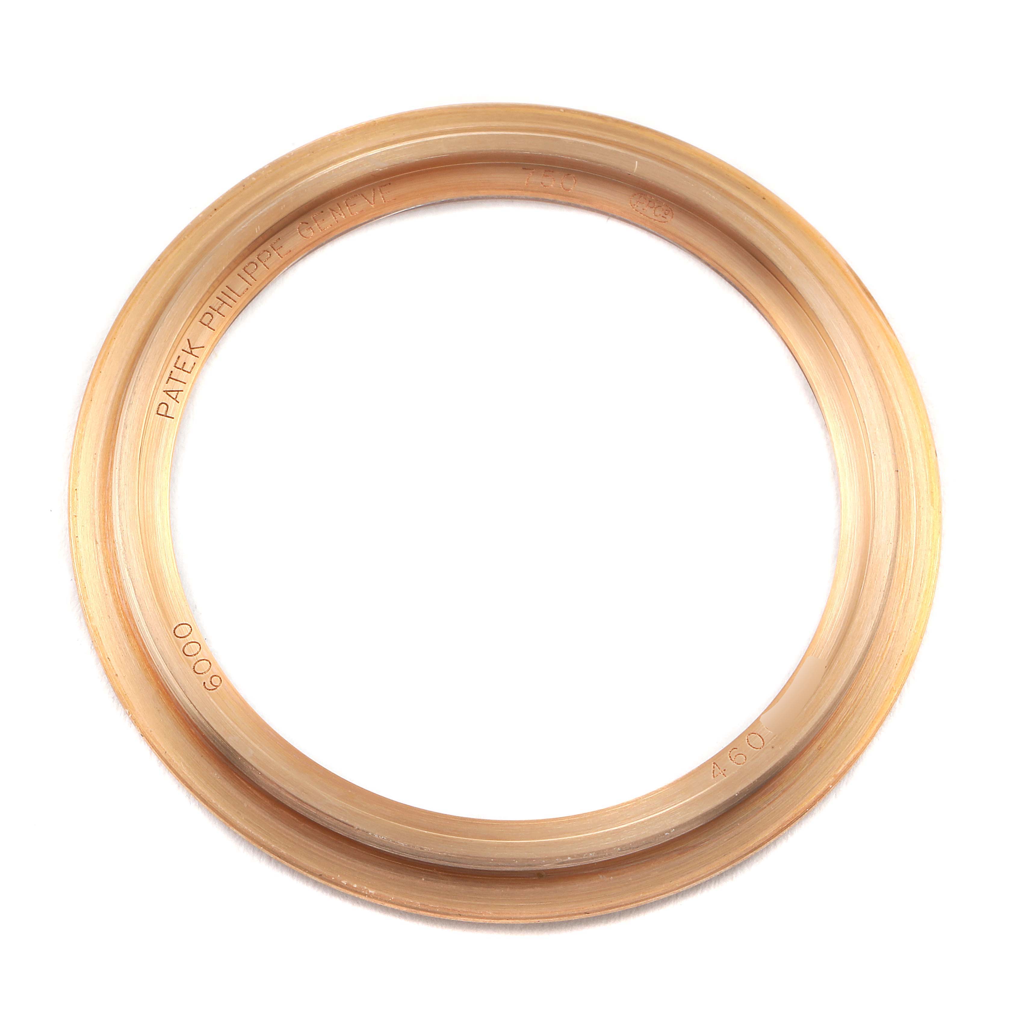 This image shows a close-up of the bezel from a Patek Philippe Calatrava 6000R Men's Rose Gold Brown Dial 6000R Men's Rose Gold Brown Dial watch.