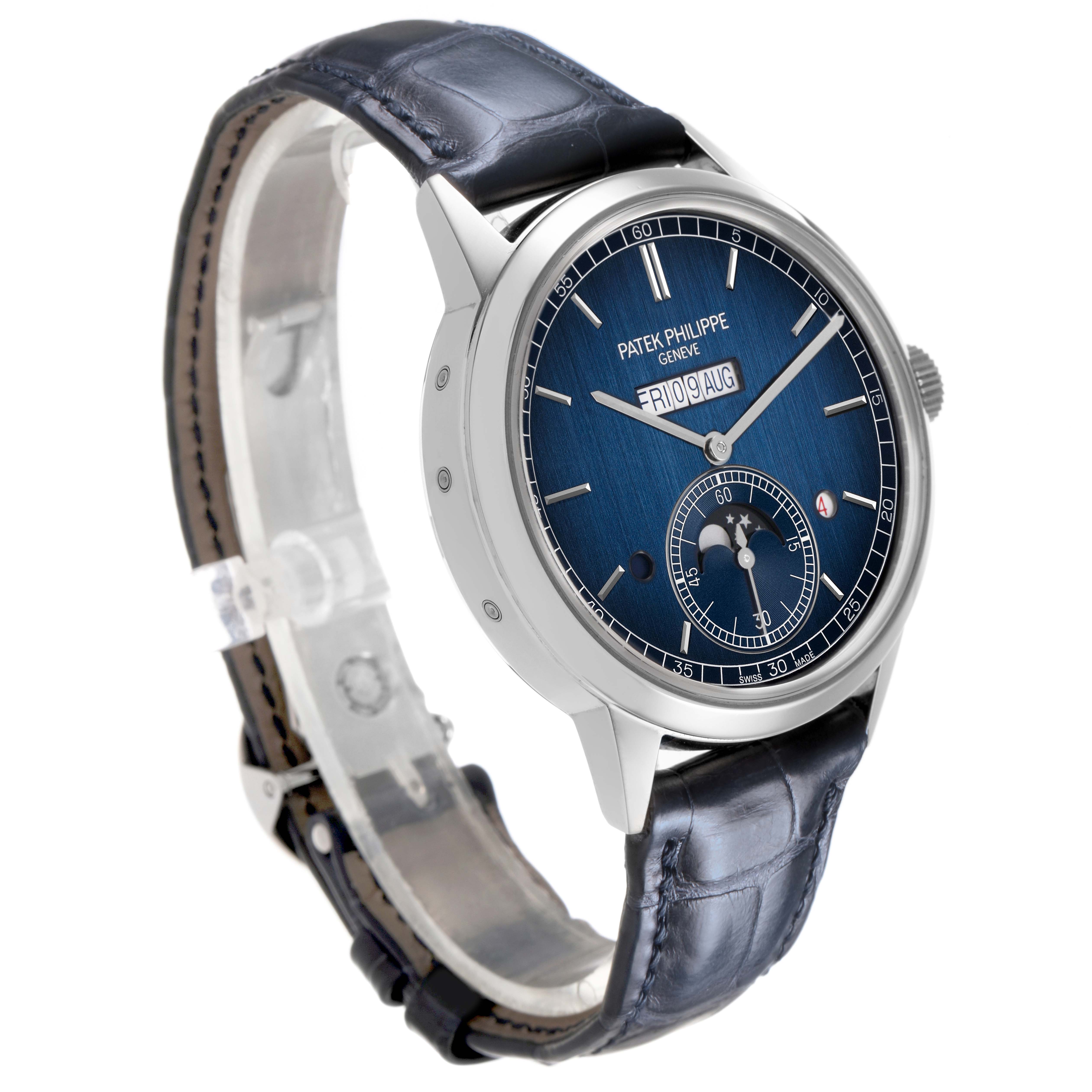 The Patek Philippe Complications 5236P-001 Men's Platinum Blue Dial model watch is shown at a three-quarter angle, displaying its blue dial, leather strap, and case.