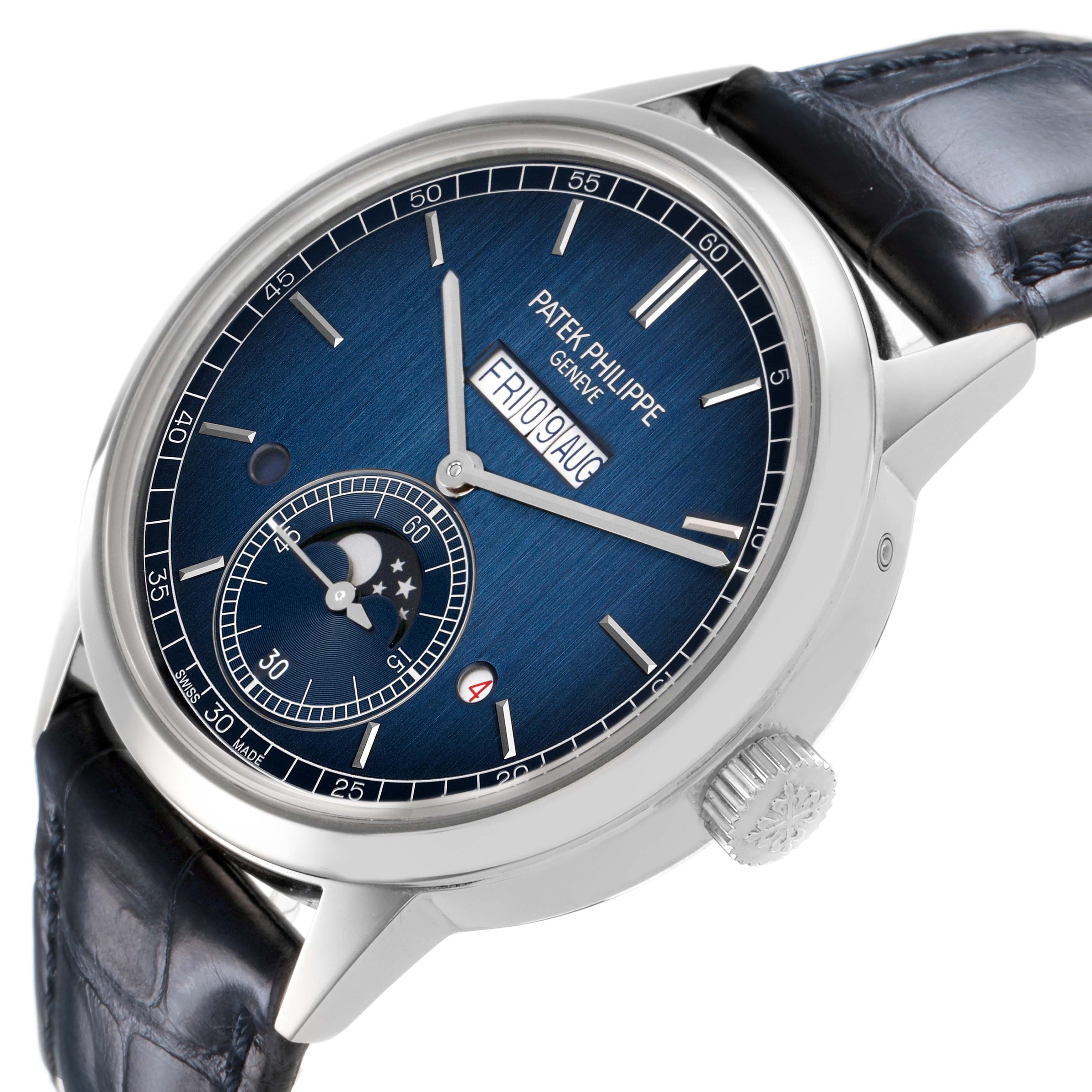 The Patek Philippe Complications 5236P-001 Men's Platinum Blue Dial watch is shown at an angle highlighting the blue dial, date display, and moon phase subdial.