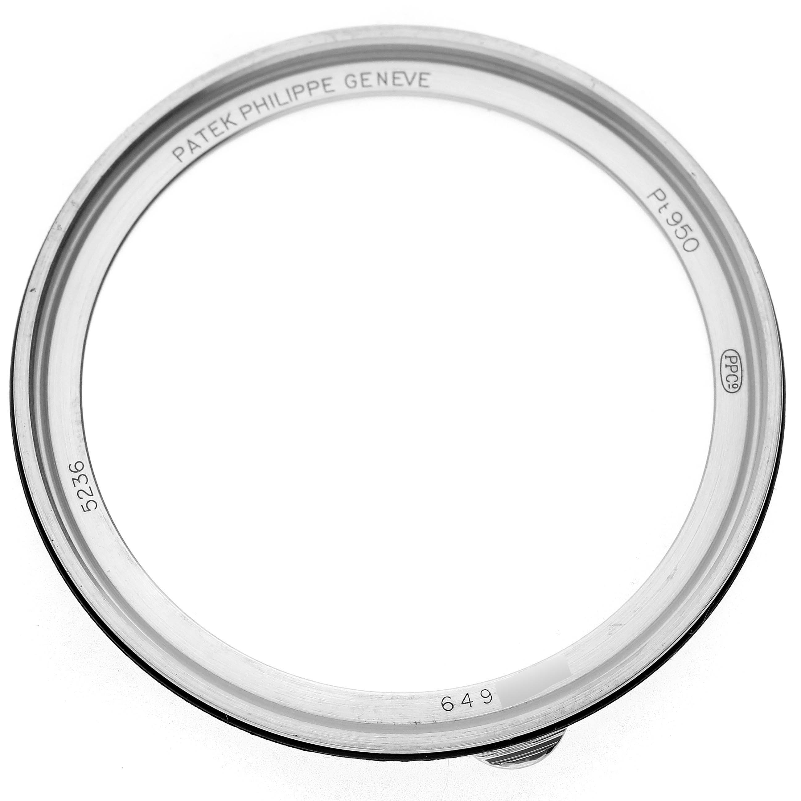 The image shows the bezel from the Patek Philippe Complications 5236P-001 Men's Platinum Blue Dial model, viewed from above, with engravings visible.