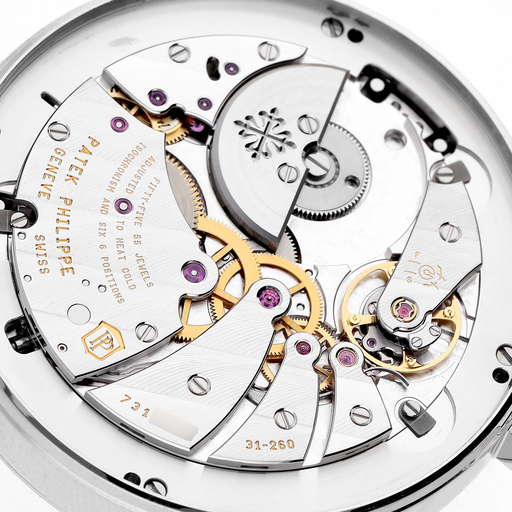 The image shows a close-up of the intricate movement components of a Patek Philippe Complications 5236P-001 Men's Platinum Blue Dial watch from a top-down angle.