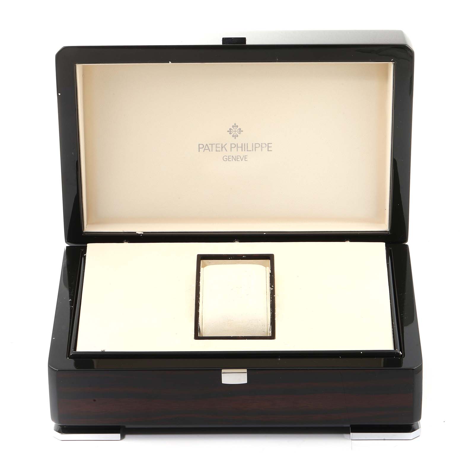 The image shows an open display box for a Patek Philippe Complications 5130G-019 Men's White Gold Silver Dial 5130G-019 Men's White Gold Silver Dial model watch, featuring the logo and name inside the lid.