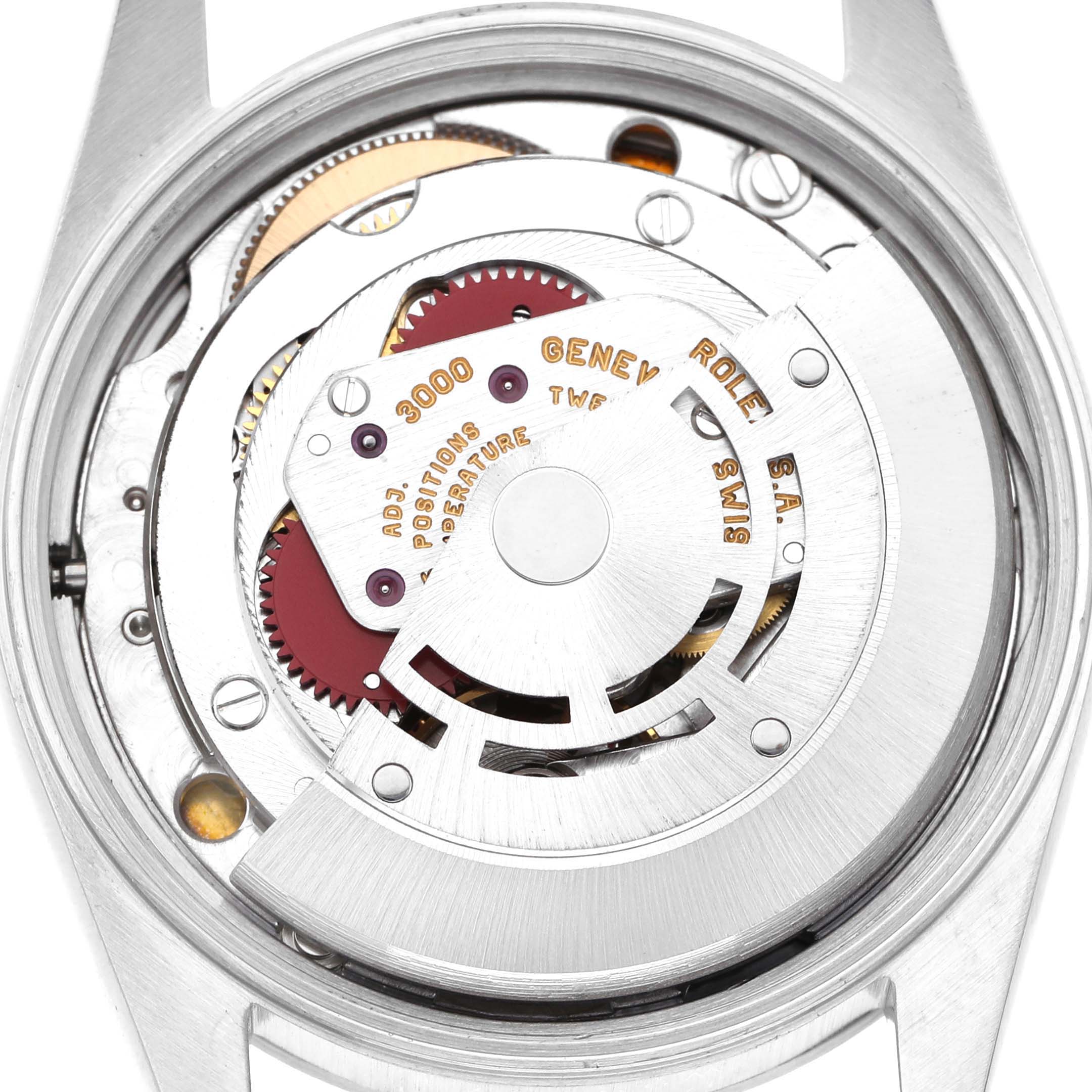 The image shows the case back removed to reveal the mechanical movement of the Rolex Air-King 14000 Men's Stainless Steel Blue Dial.
