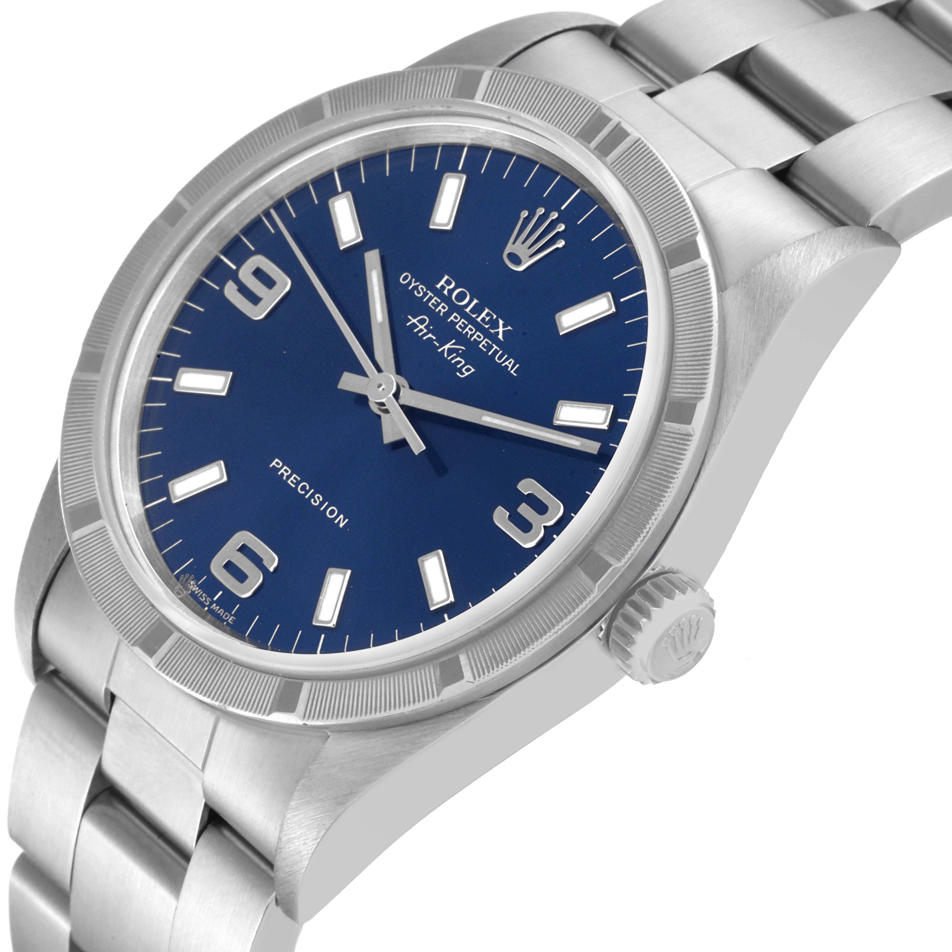 The image shows a side angle view of the Rolex Air-King 14010 Men's Stainless Steel Blue Dial 14010 Men's Stainless Steel Blue Dial watch, highlighting the crown, bracelet, and blue dial.