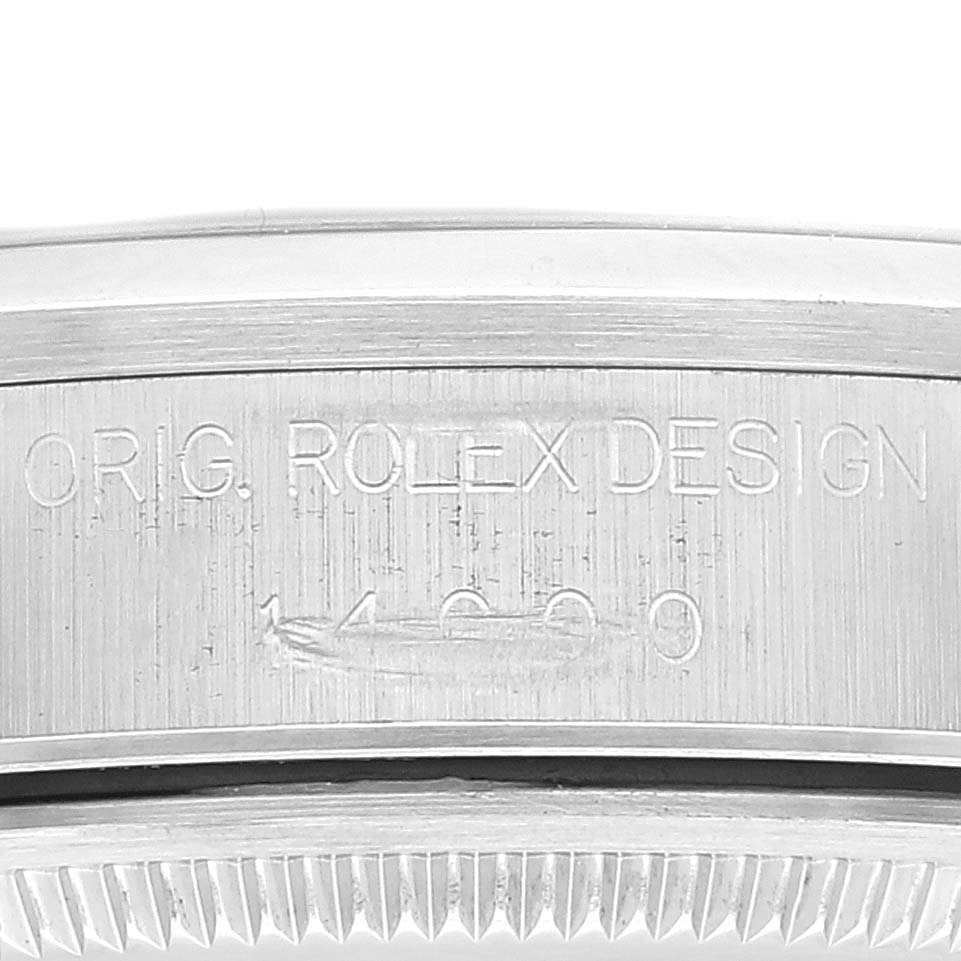 This is a close-up shot of the side of a Rolex Air-King 14000 Men's Stainless Steel Blue Dial 14000 Men's Stainless Steel Blue Dial watch, showing the engraved model number and "ORIG. ROLEX DESIGN" text.