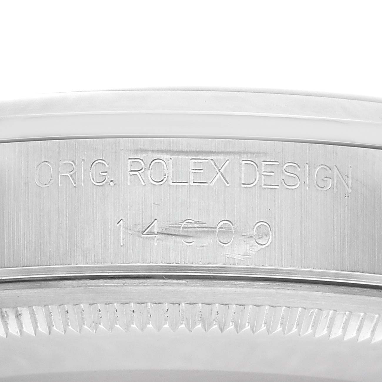 The image shows a close-up of the Rolex Air-King 14000 Men
s Stainless Steel Black Dial 14000 Men
s Stainless Steel Black Dial model
s case, featuring the engraved reference number and design markings.