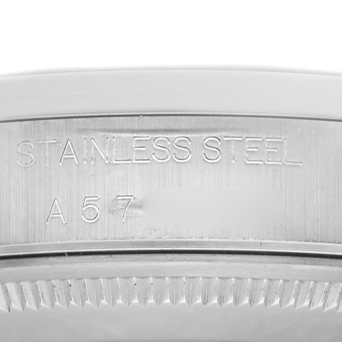 The image shows a close-up of the Rolex Air-King 14000 Men
s Stainless Steel Black Dial 14000 Men
s Stainless Steel Black Dial
s stainless steel case with engraved text.