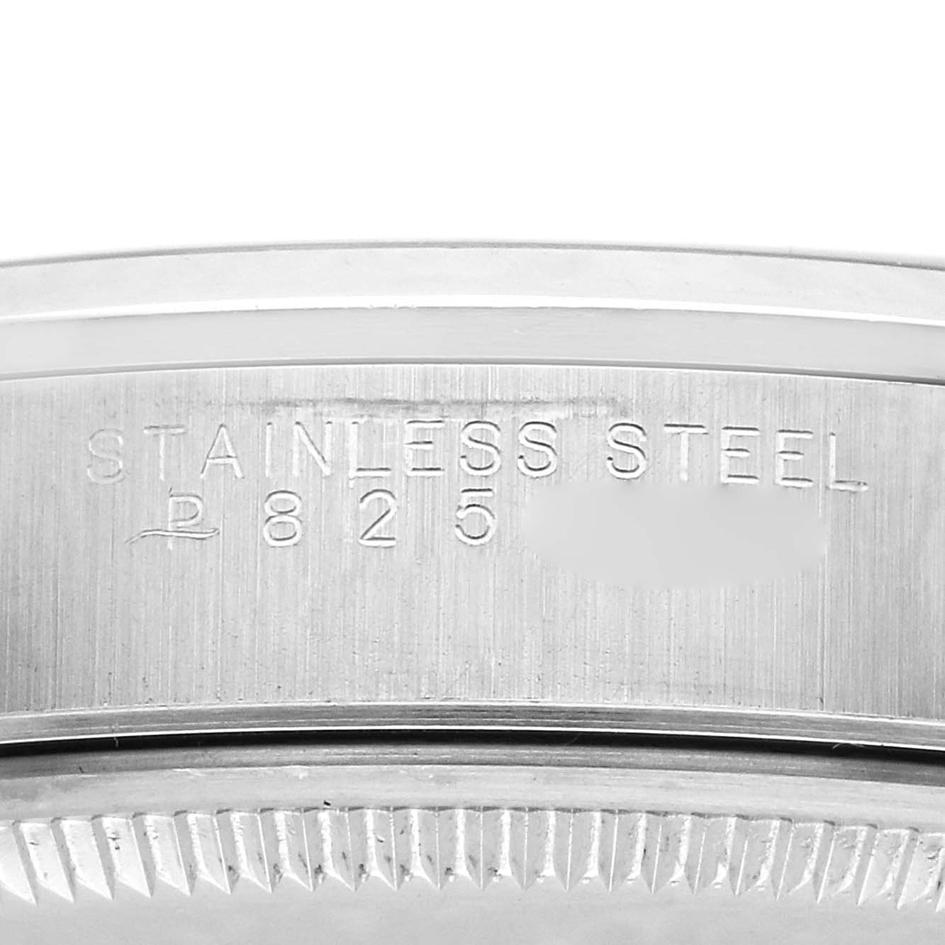 The image shows a close-up of the engravings and serrated edge on the stainless steel bezel of a Rolex Air-King 14000 Men
s Stainless Steel Silver Dial 14000 Men
s Stainless Steel Silver Dial watch.
