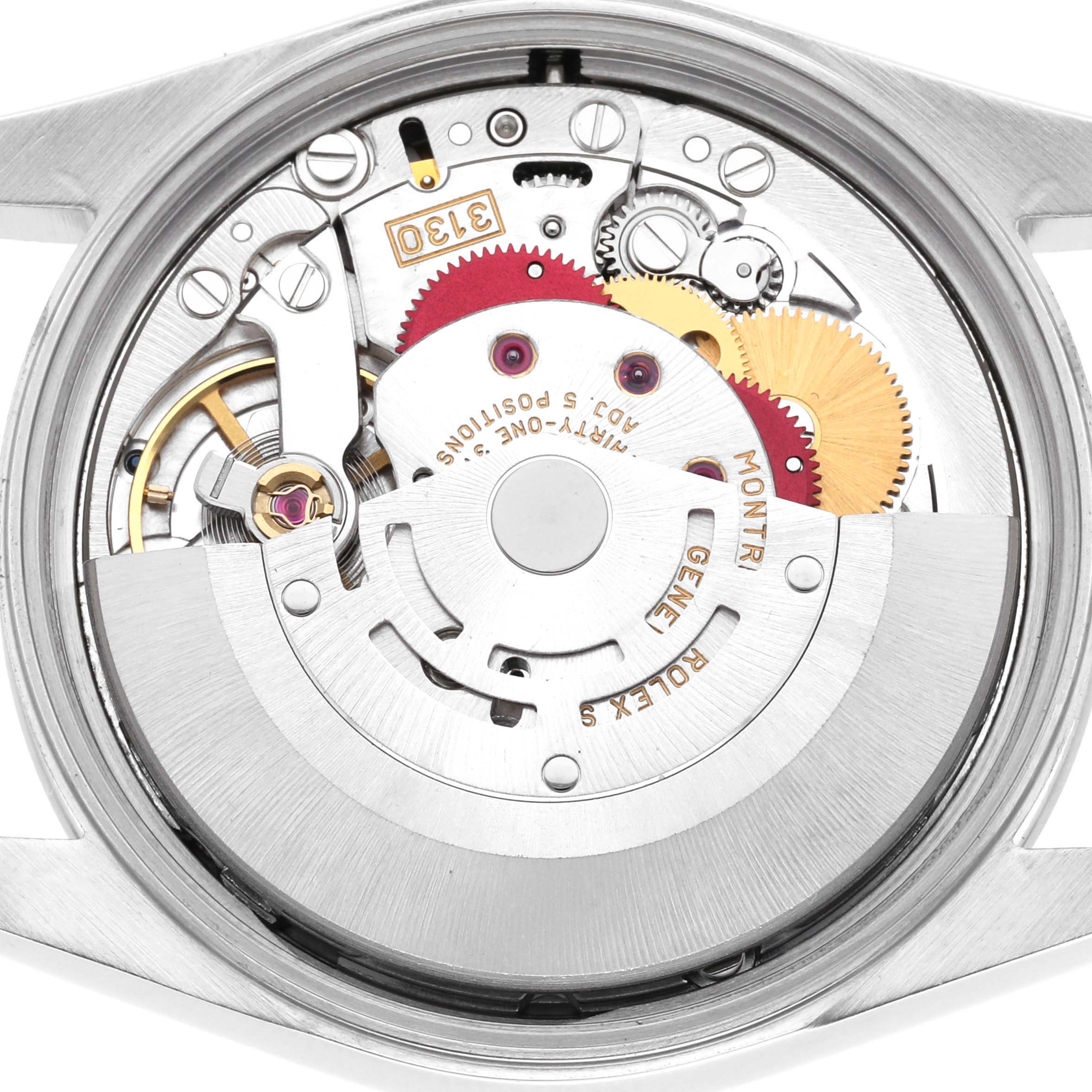 The image shows the internal mechanism of the Rolex Air-King 14000 Men
s Stainless Steel Silver Dial 14000 Men
s Stainless Steel Silver Dial watch viewed from the back, highlighting gears and the rotor.