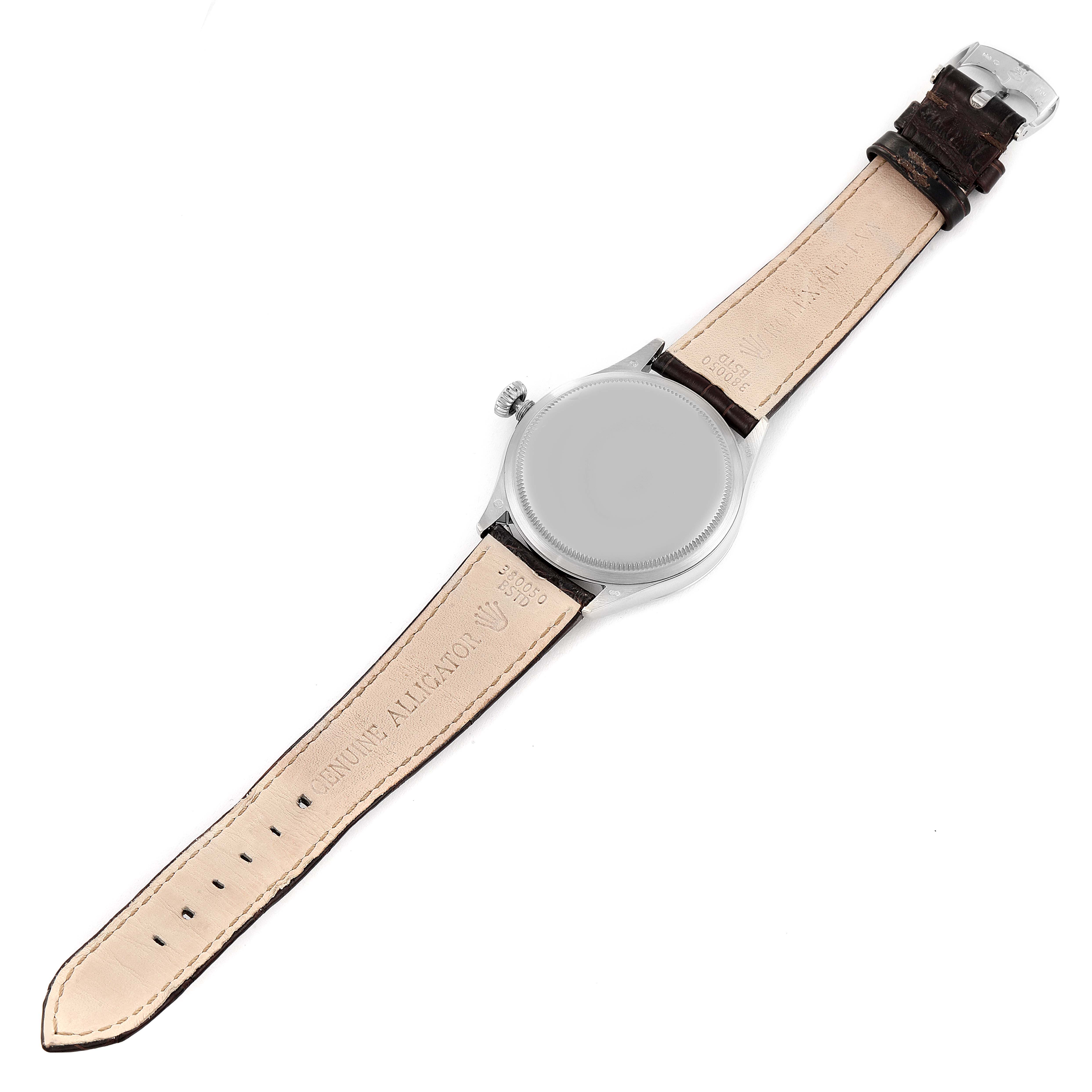 The image shows the back case and full leather strap of a Rolex Cellini 50509 Men's White Gold Black Dial 50509 Men's White Gold Black Dial watch laid flat.