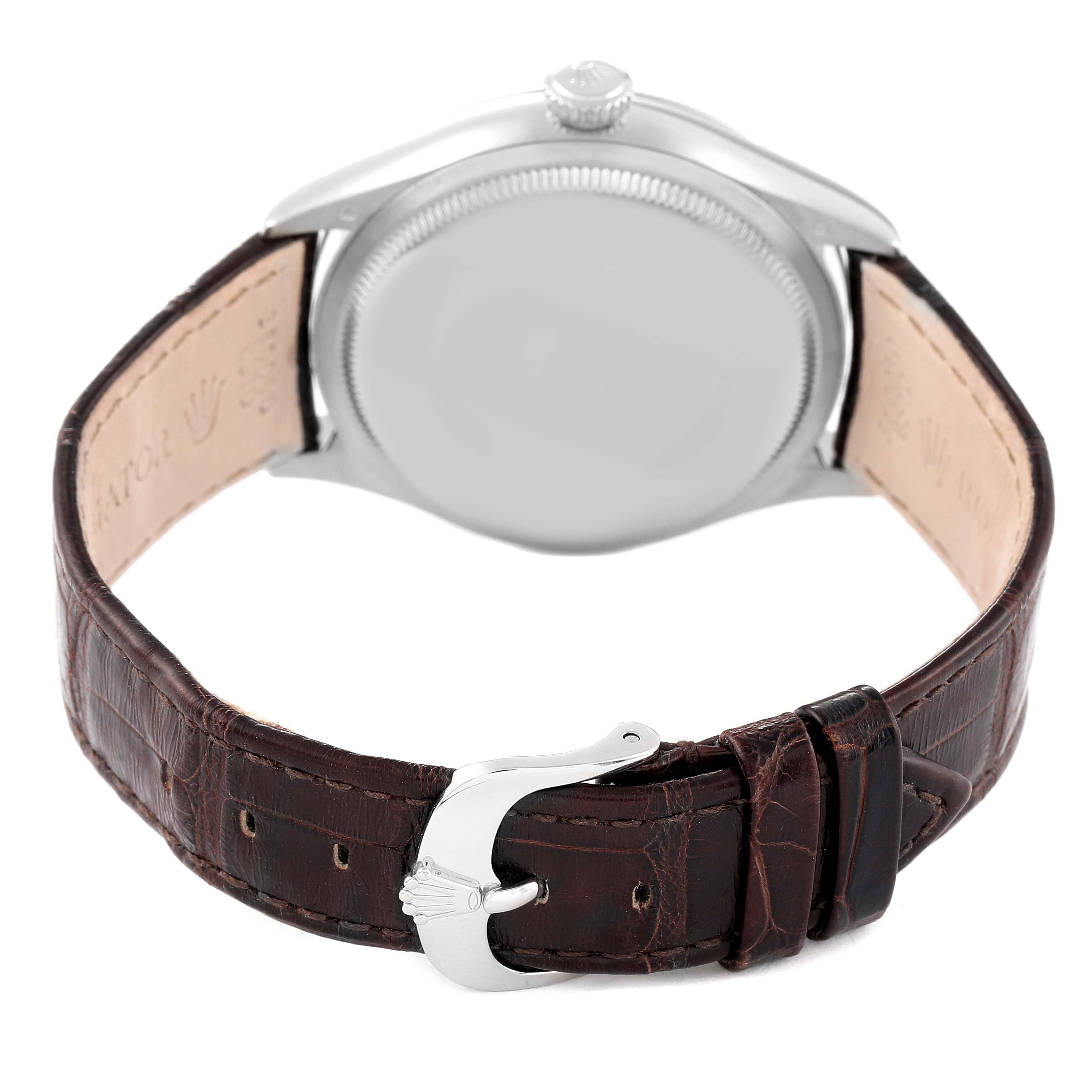 The image shows the back view of the Rolex Cellini 50509 Men's White Gold Black Dial 50509 Men's White Gold Black Dial watch with a leather strap and a silver buckle.