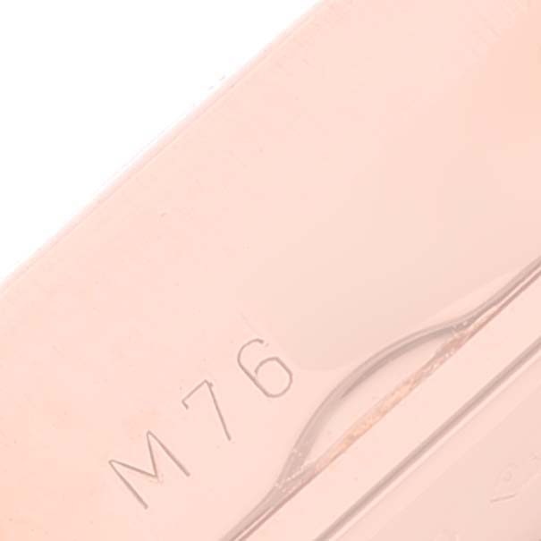 This image shows a close-up of what appears to be the side engraving on a Rolex Cellini 5442 Men's Rose Gold Black Dial 5442 Men's Rose Gold Black Dial watch.