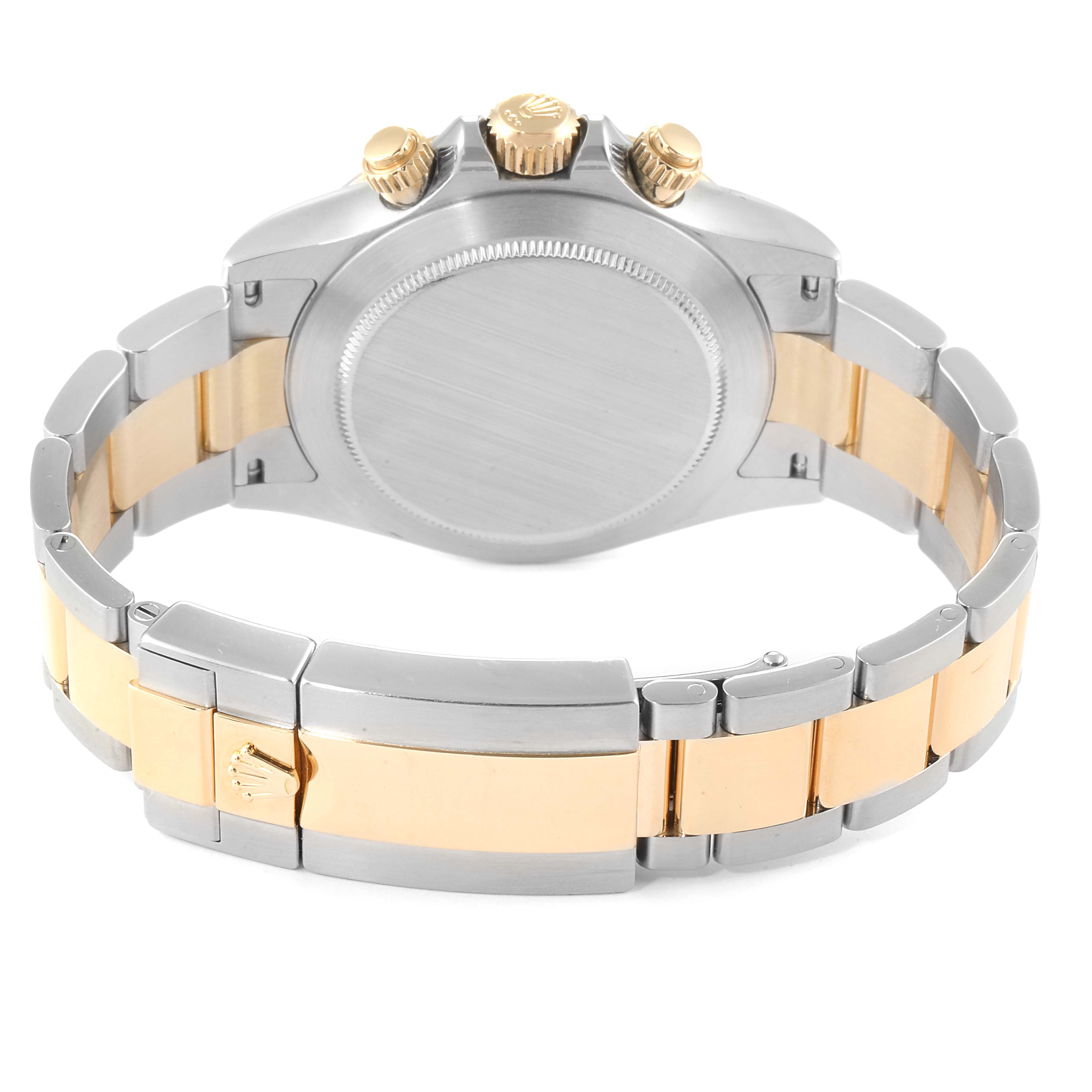 The image shows the back view of a Rolex Daytona 116503 Men's Steel and Gold (two tone) Black Dial 116503 Men's Steel and Gold (two tone) Black Dial watch, highlighting its bracelet, clasp, and crown.