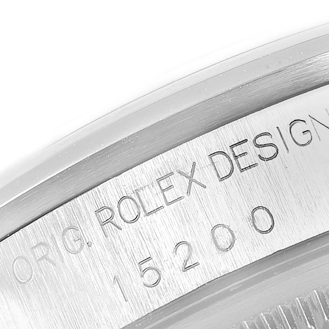 This is a close-up of the side of a Rolex Date 15200 Men's Stainless Steel Pink Dial 15200 Men's Stainless Steel Pink Dial watch showing the engraving "ORIG. ROLEX DESIGN" with model number 15200.