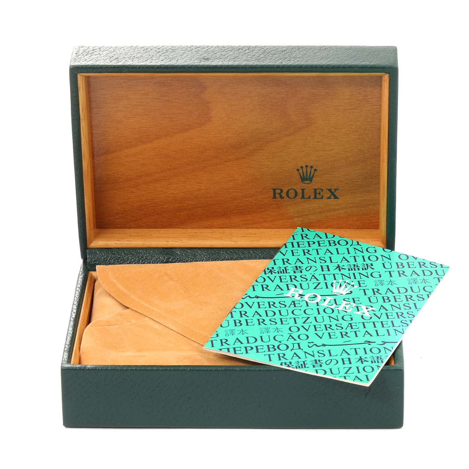 The image shows a green Rolex box for the Date model with an open lid and accompanying documents.