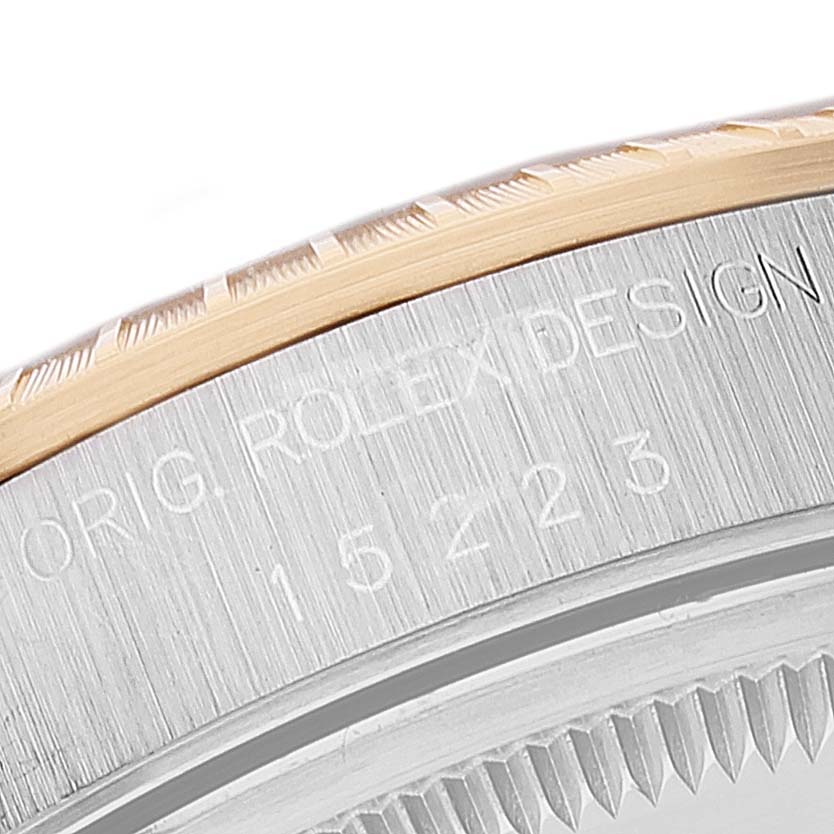 The image shows a close-up of the case side, bezel, and serial number of the Rolex Date 15223 Men's Steel and Gold (two tone) Grey Dial 15223 Men's Steel and Gold (two tone) Grey Dial model.