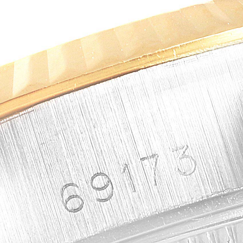 This image shows a close-up of the case and bezel along with the model number engraving of the Rolex Datejust 69173 Women
s Steel and Gold (two tone) Champagne Dial 69173 Women
s Steel and Gold (two tone) Champagne Dial watch.