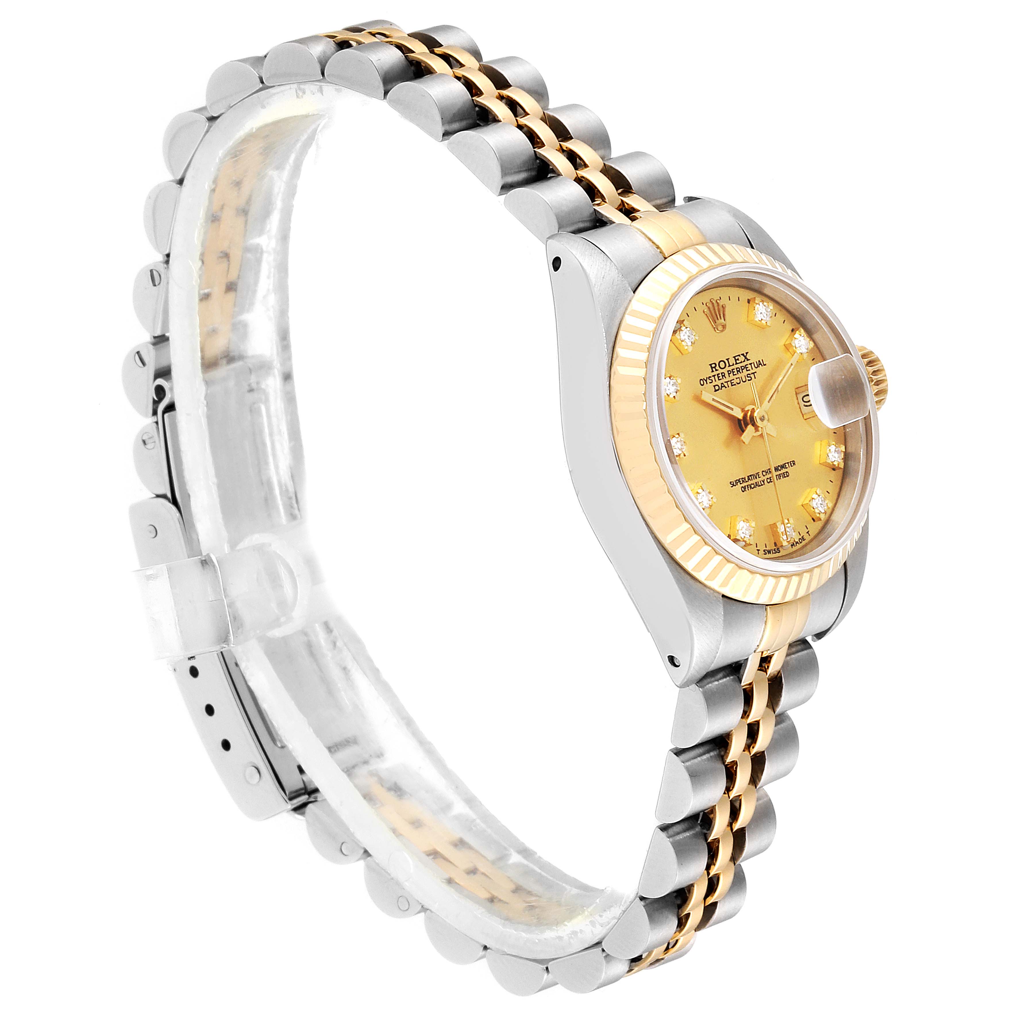 The image shows a side angle of a Rolex Datejust 69173 Women
s Steel and Gold (two tone) Champagne Dial 69173 Women
s Steel and Gold (two tone) Champagne Dial watch, highlighting the two-tone bracelet, fluted bezel, and dial with date display.