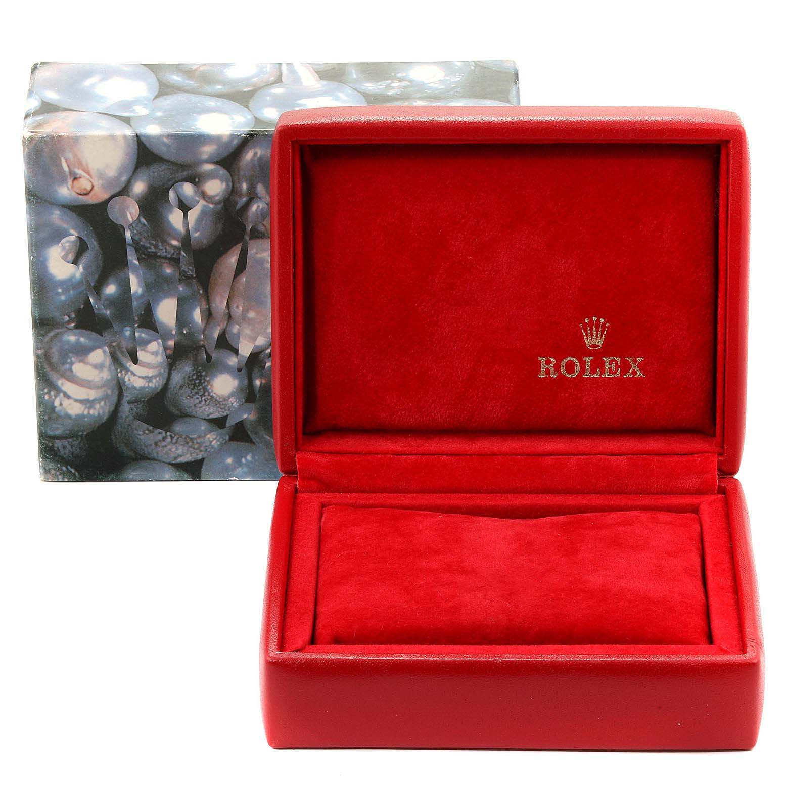 The image shows a red Rolex watch box, open, with the brand name and logo, for a Datejust model.