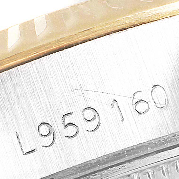 This image shows a close-up of the engraved serial number on the side of the case of a Rolex Datejust 69173 Women's Steel and Gold (two tone) Champagne Dial 69173 Women's Steel and Gold (two tone) Champagne Dial watch.