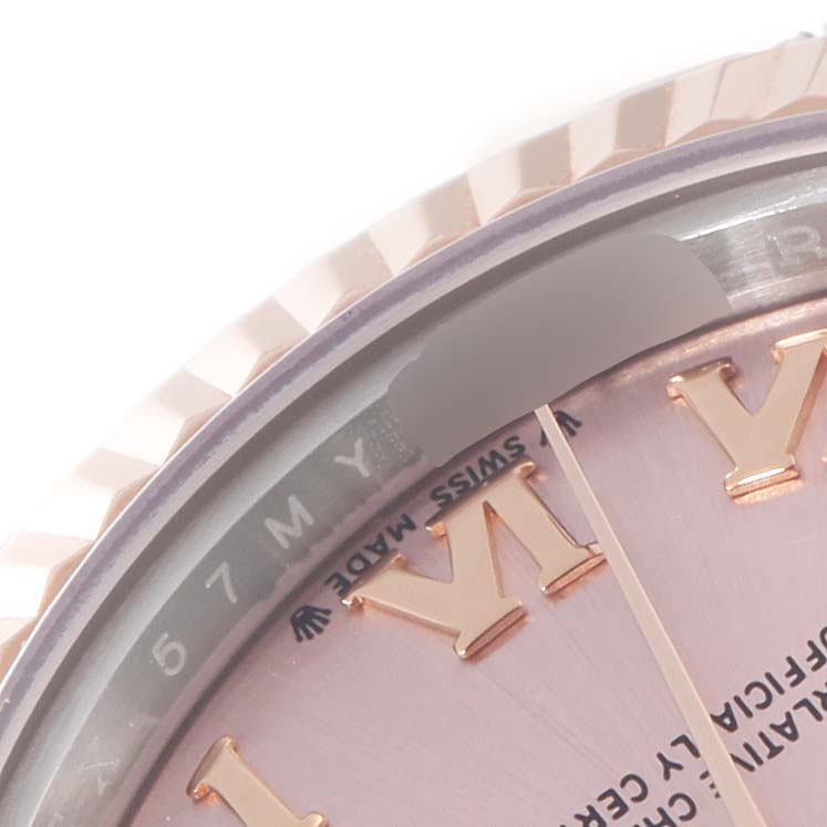 This image shows a close-up view of the bezel and part of the dial of a Rolex Datejust 279171 Women's Steel and Gold (two tone) Pink Dial 279171 Women's Steel and Gold (two tone) Pink Dial watch.