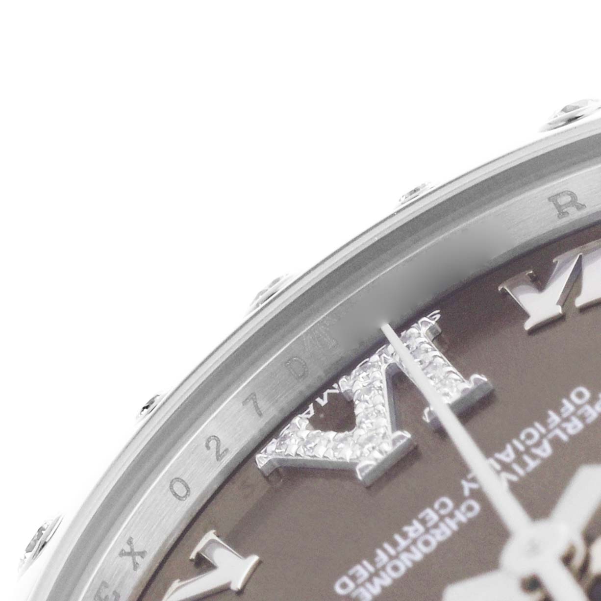The image shows a close-up of the dial and bezel of a Rolex Datejust 178344 Women's Stainless Steel Brown Dial, highlighting the upper part with diamond-dusted Roman numerals.