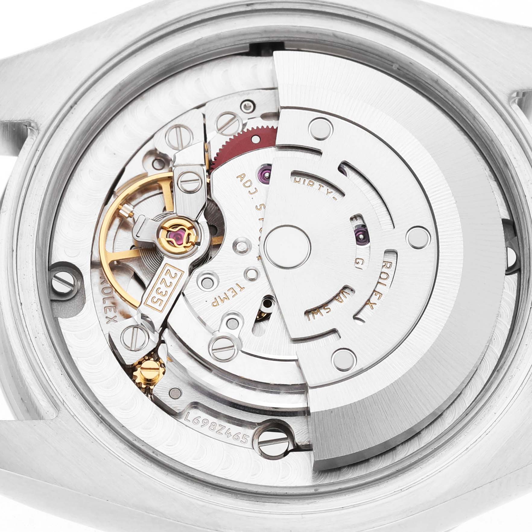 The image shows the movement of a Rolex Datejust 178344 Women's Stainless Steel Brown Dial watch from a back angle, highlighting its intricate mechanical parts.