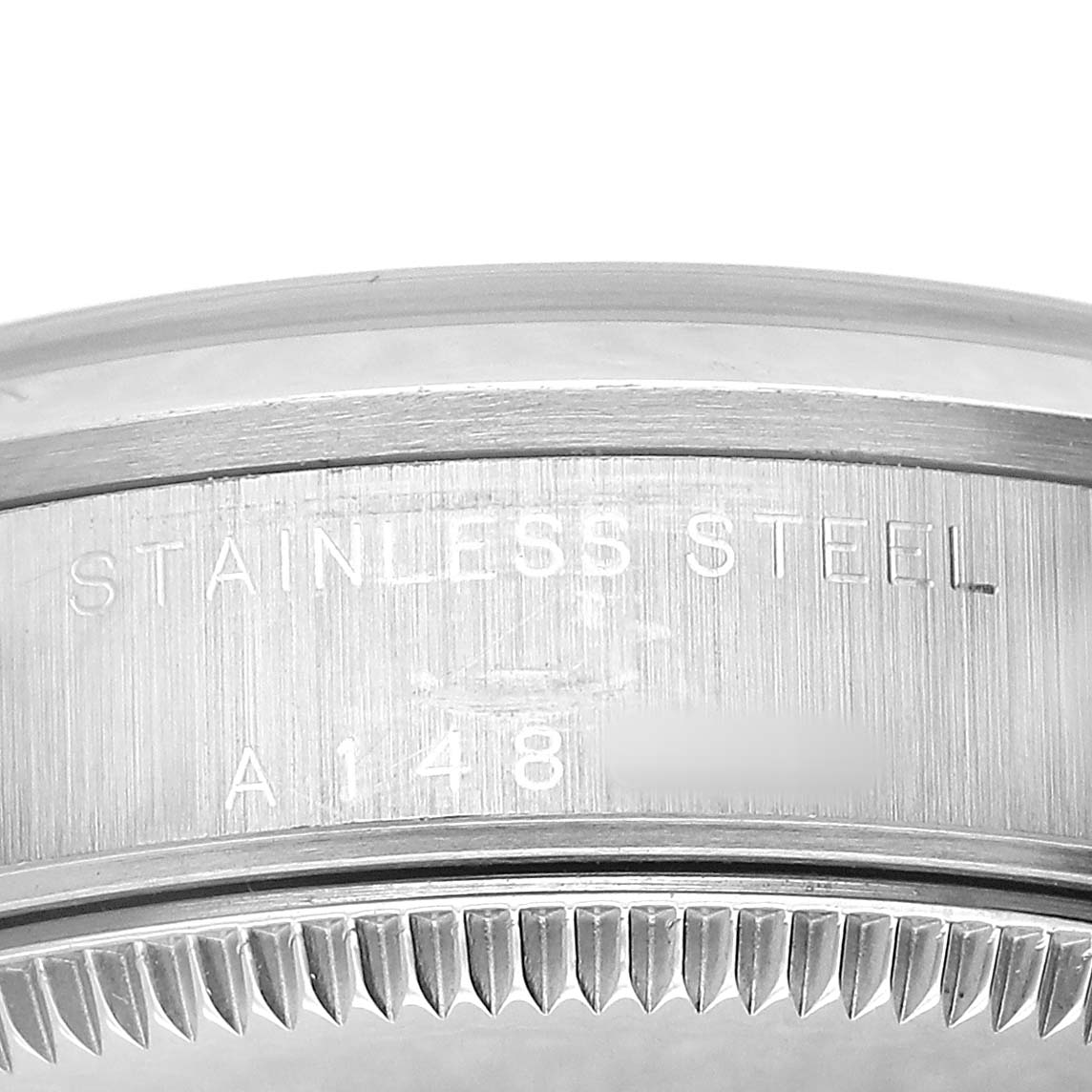 The image shows the side view of a Rolex Datejust 78240 Women's Stainless Steel Silver Dial watch focusing on the brushed stainless steel case and part of the fluted bezel.