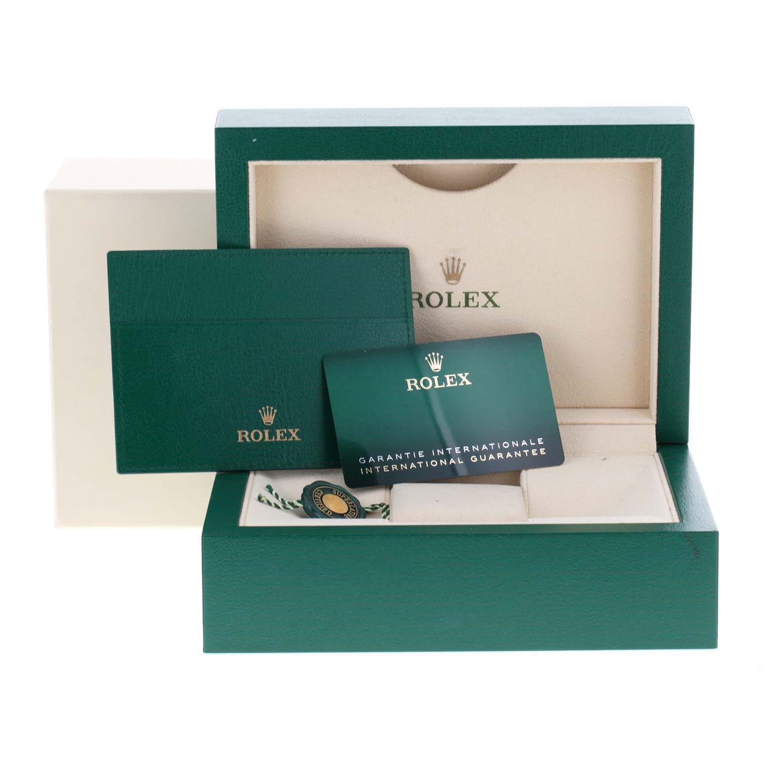 The image shows the packaging and accessories for a Rolex Datejust 126281 Men
s Steel and Gold (two tone) Mother of Pearl Dial 126281 Men
s Steel and Gold (two tone) Mother of Pearl Dial watch, including the box, warranty card, and booklet.