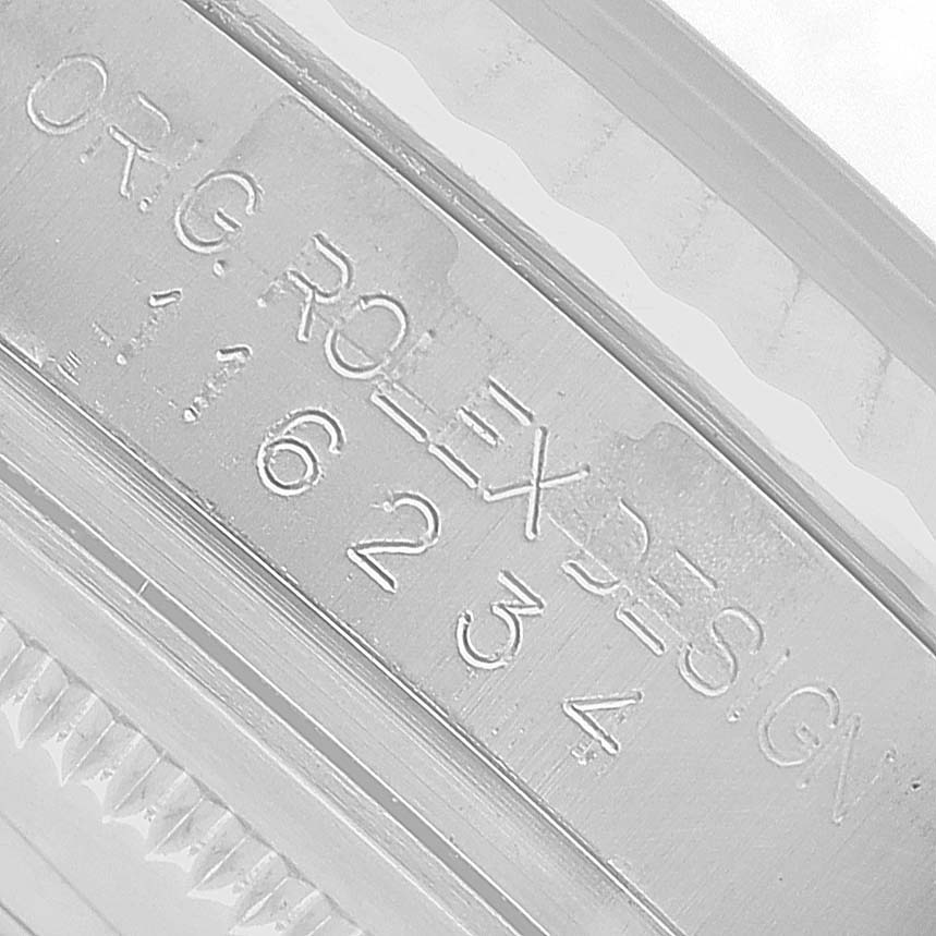 The image shows an engraved Rolex Datejust 116234 Men's Stainless Steel Silver Dial model number "16234" on the side of the watch case.