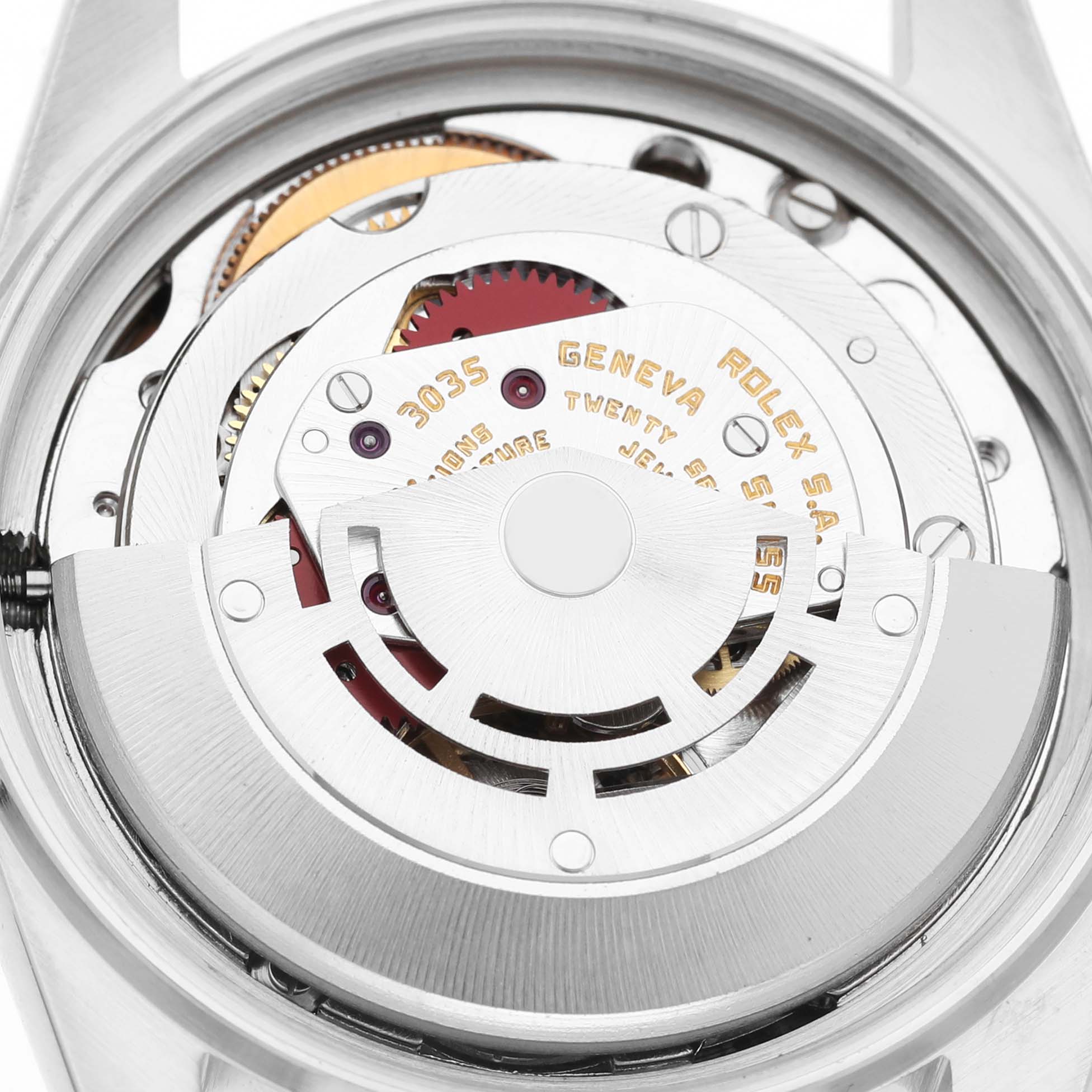 The image shows the movement and inner mechanics of a Rolex Datejust 16013 Men's Steel and Gold (two tone) Champagne Dial watch from a back angle, highlighting the rotor and gears.