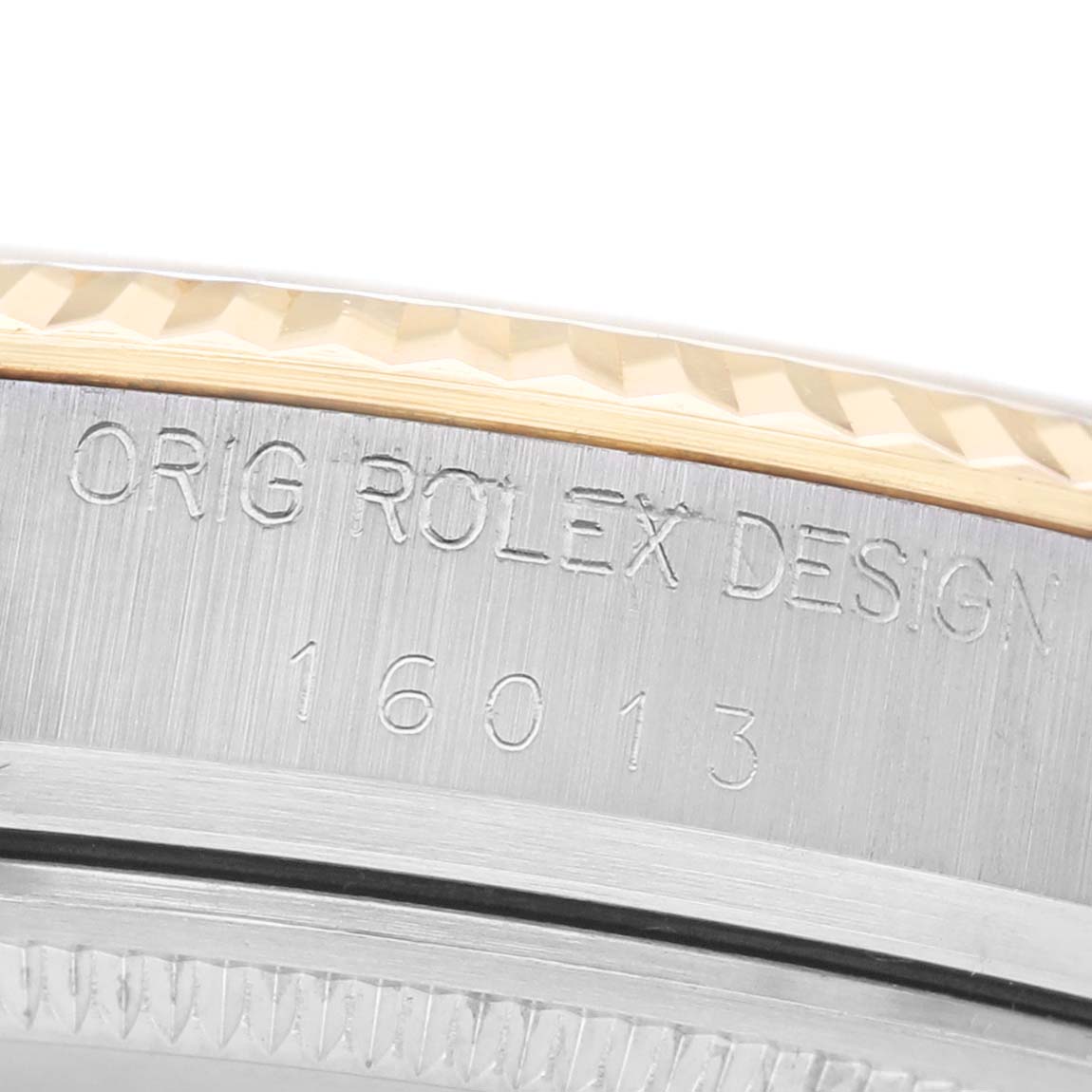 The image shows a close-up of the side of a Rolex Datejust 16013 Men's Steel and Gold (two tone) Champagne Dial, highlighting the model number and design engraving.