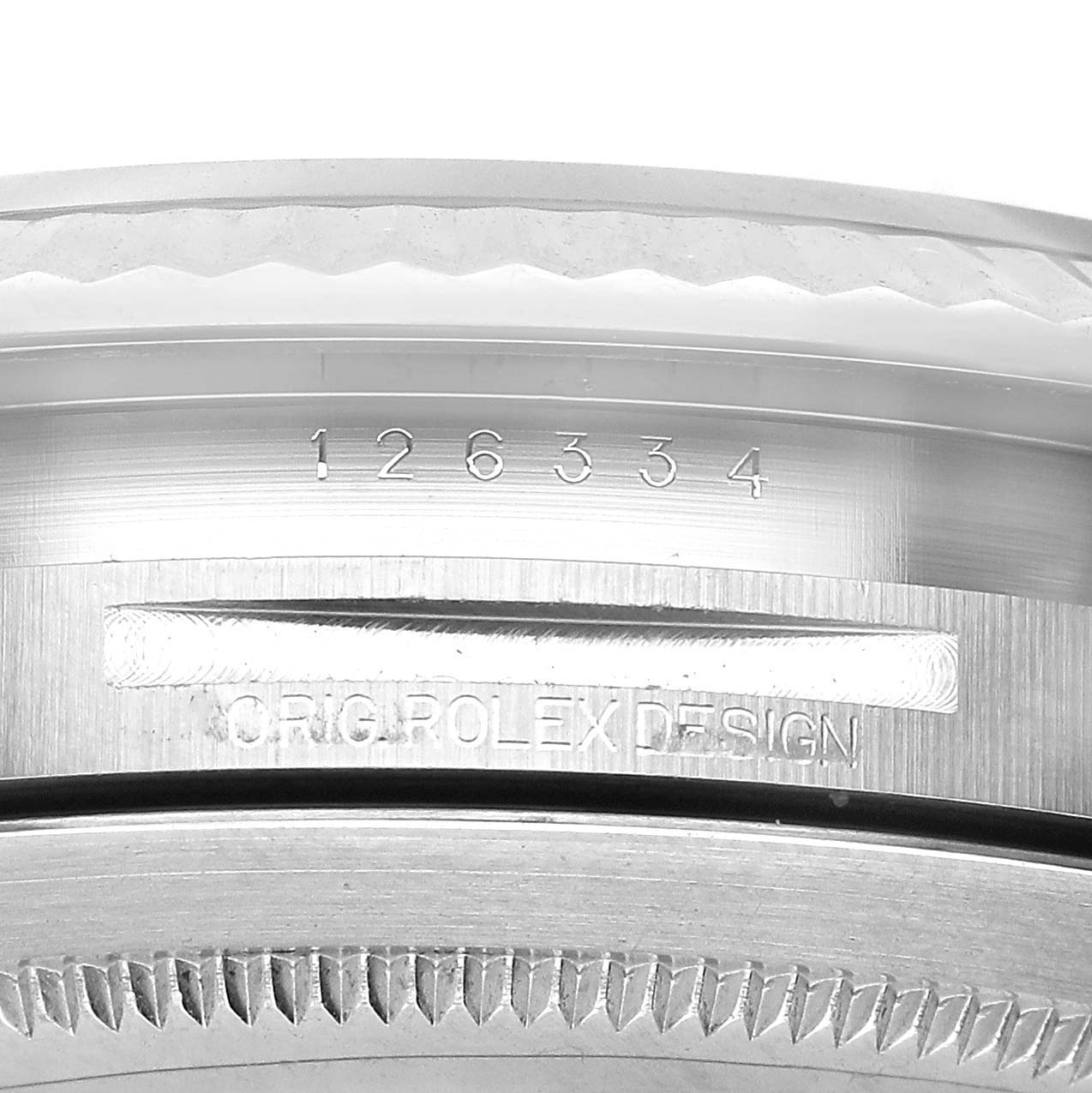 The image shows a close-up of the side of a Rolex Datejust 41 M126334-0018 Men's Stainless Steel Black Dial, highlighting the model number and "Rolex Design" engraving.