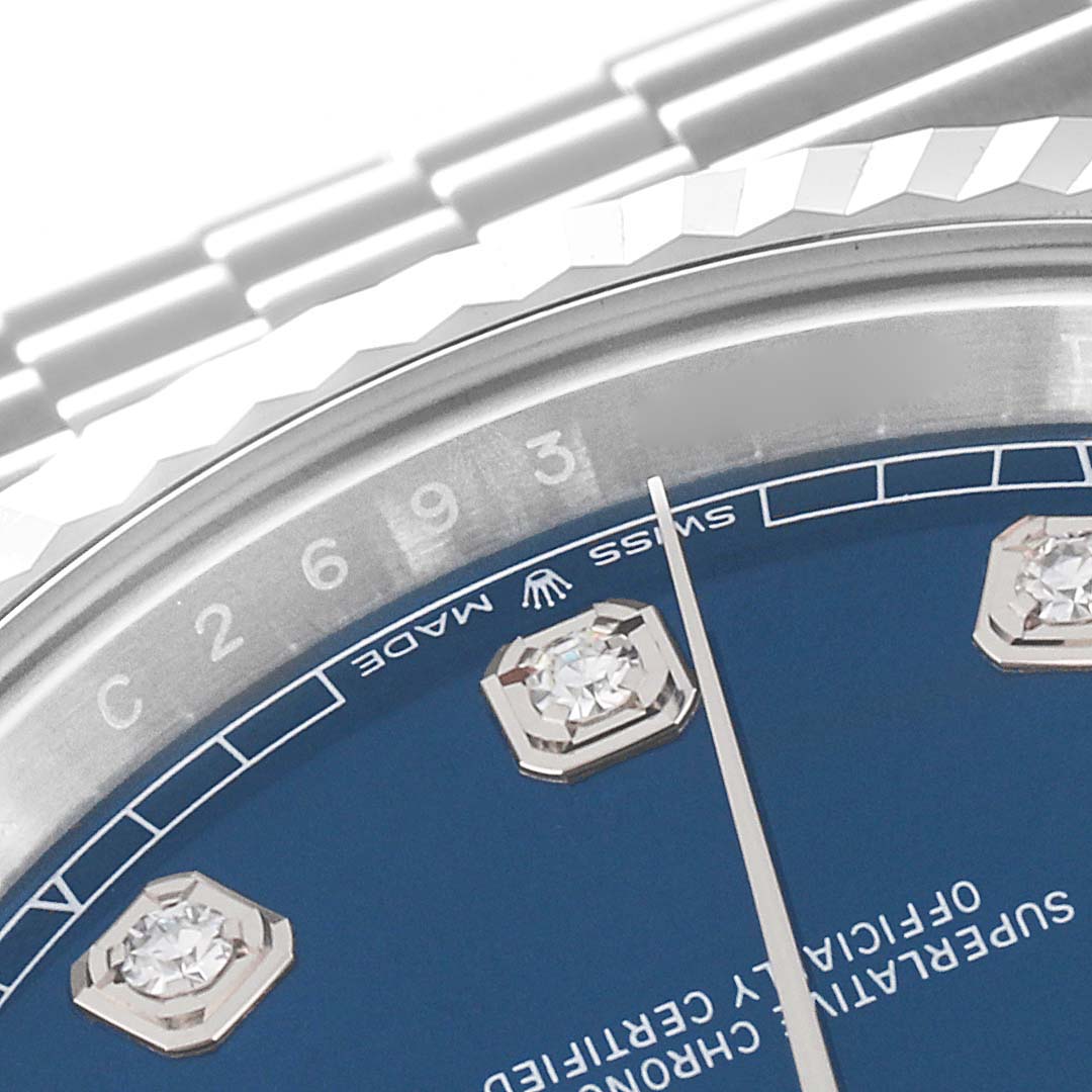 This image shows a close-up of the dial, bezel, and part of the bracelet of a Rolex Datejust 41 126334 Men
s Stainless Steel Blue Dial 126334 Men
s Stainless Steel Blue Dial watch, emphasizing the diamond hour markers and minute indicators.