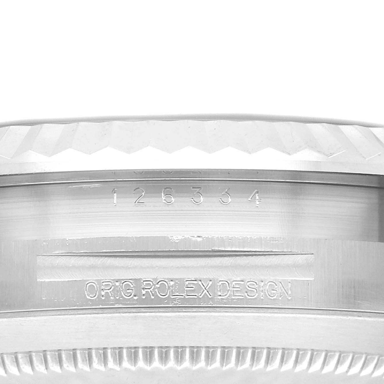 The image shows a close-up side view of the Rolex Datejust 41 126334 Men
s Stainless Steel Blue Dial 126334 Men
s Stainless Steel Blue Dial, focusing on the case side with engraved serial and "ORIG ROLEX DESIGN" markings.