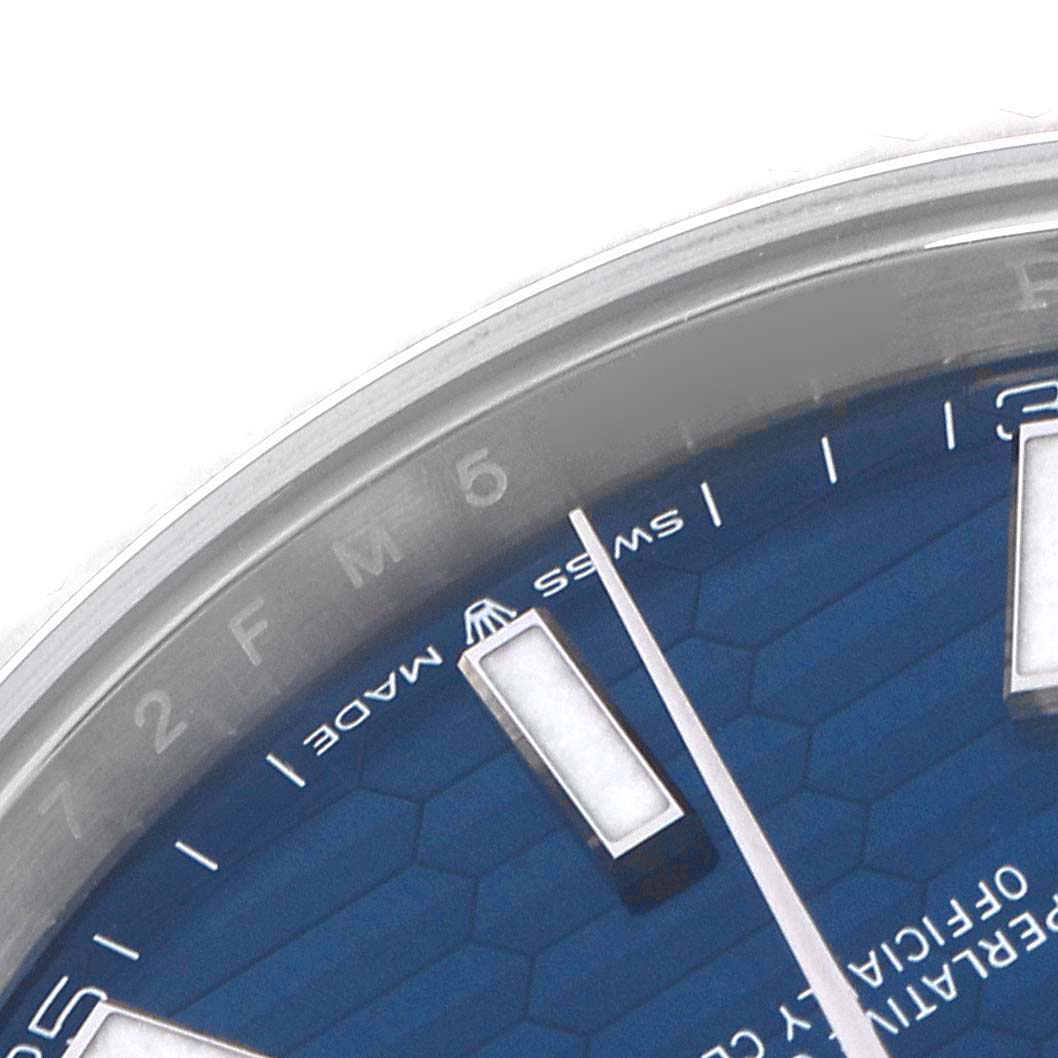 The image shows a close-up of the dial and bezel of a Rolex Datejust 41 126334 Men
s Stainless Steel Blue Dial 126334 Men
s Stainless Steel Blue Dial, highlighting the hour markers and textured dial.