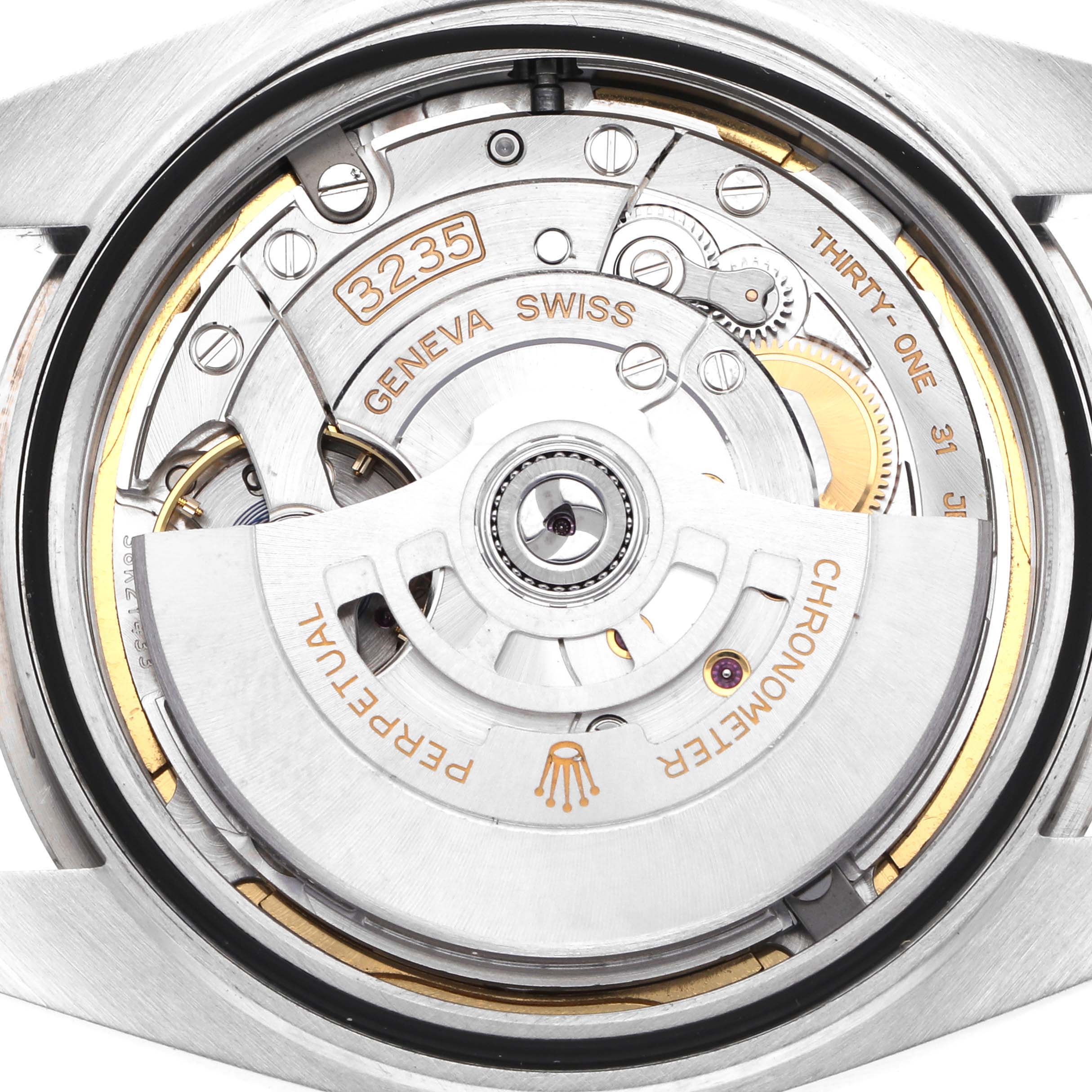 The image shows the movement and rotor through the case back of a Rolex Datejust 41 126334 Men
s Stainless Steel Blue Dial 126334 Men
s Stainless Steel Blue Dial, highlighting the intricate mechanics.