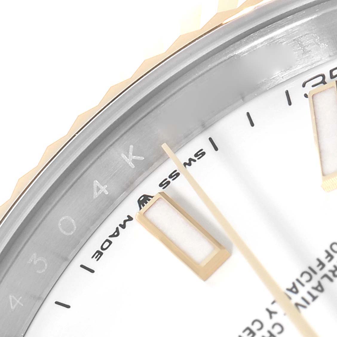 This close-up image shows the edge of the dial, bezel, and part of the minute and hour markers on a Rolex Datejust 41 126333 Men's Steel and Gold (two tone) White Dial 126333 Men's Steel and Gold (two tone) White Dial watch.