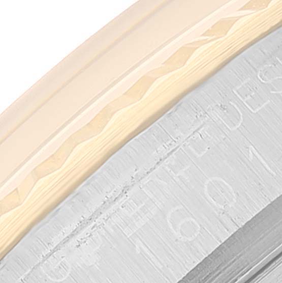 The image shows a close-up angle of the bezel and the outer rim of the case back of a Rolex Datejust 1601 Men
s Steel and Gold (two tone) Champagne Dial 1601 Men
s Steel and Gold (two tone) Champagne Dial watch.
