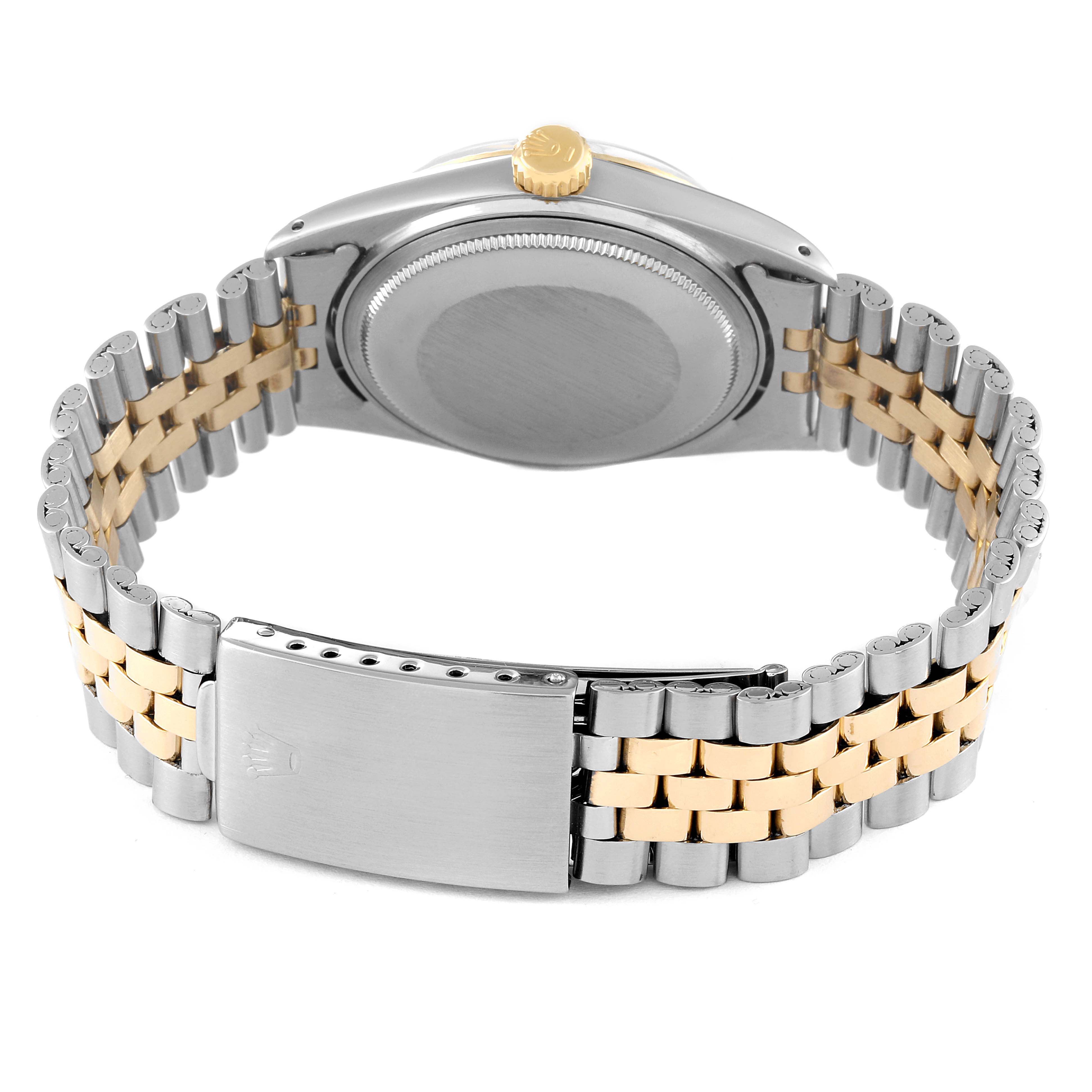 The image shows the back of the Rolex Datejust 1601 Men
s Steel and Gold (two tone) Champagne Dial 1601 Men
s Steel and Gold (two tone) Champagne Dial watch, highlighting the case, crown, and two-tone bracelet and clasp.