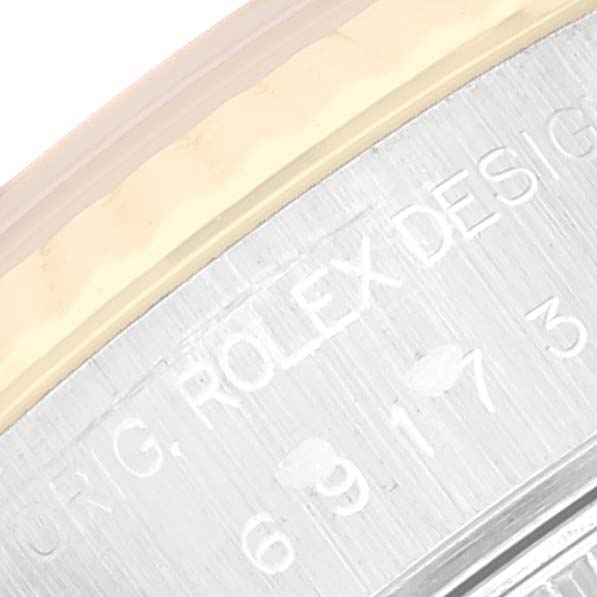 This image shows a close-up of the engraved text on the Rolex Datejust 69173 Women's Steel and Gold (two tone) Blue Dial 69173 Women's Steel and Gold (two tone) Blue Dial watch bezel.