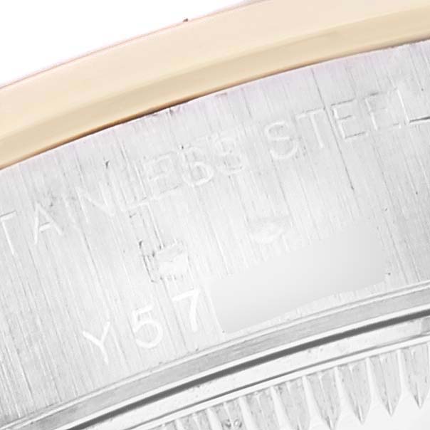 The image shows a close-up of the back case engraving of a Rolex Datejust 79163 Women's Steel and Gold (two tone) White Dial 79163 Women's Steel and Gold (two tone) White Dial watch.
