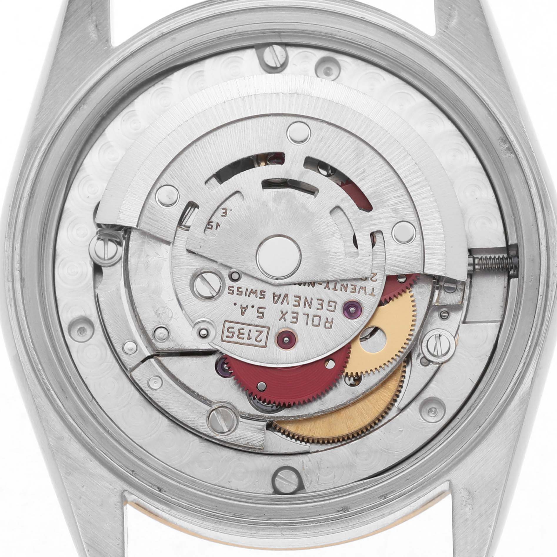 The image shows the back view of the Rolex Datejust 68273 Women's Steel and Gold (two tone) Champagne Dial, displaying its intricate movement and inner components.