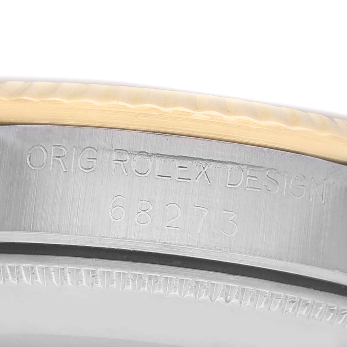 The image shows a close-up of the case side of a Rolex Datejust 68273 Women's Steel and Gold (two tone) Champagne Dial, displaying the engraved model number.