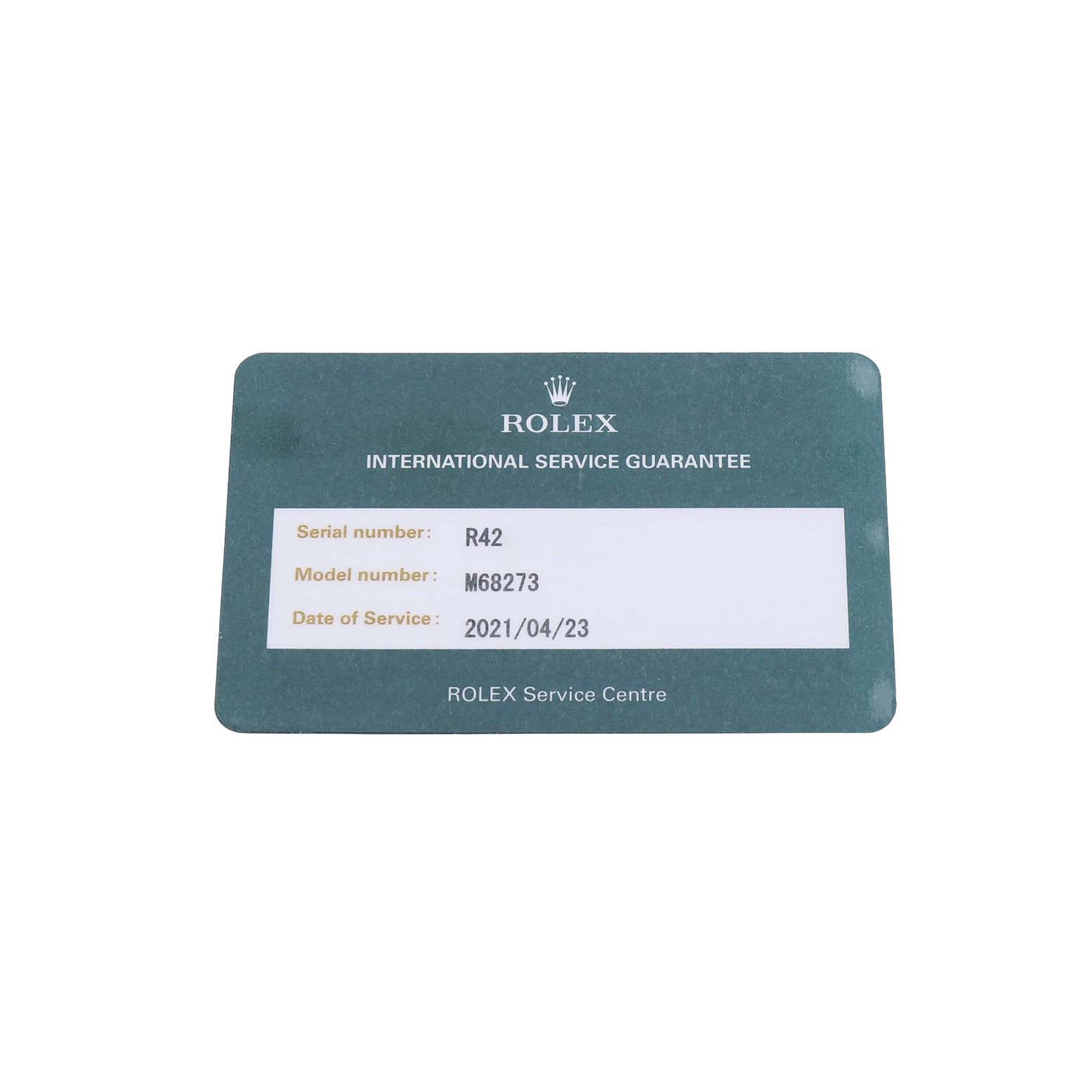 This image shows a Rolex service guarantee card for a Datejust model, detailing the serial and model number, and service date.