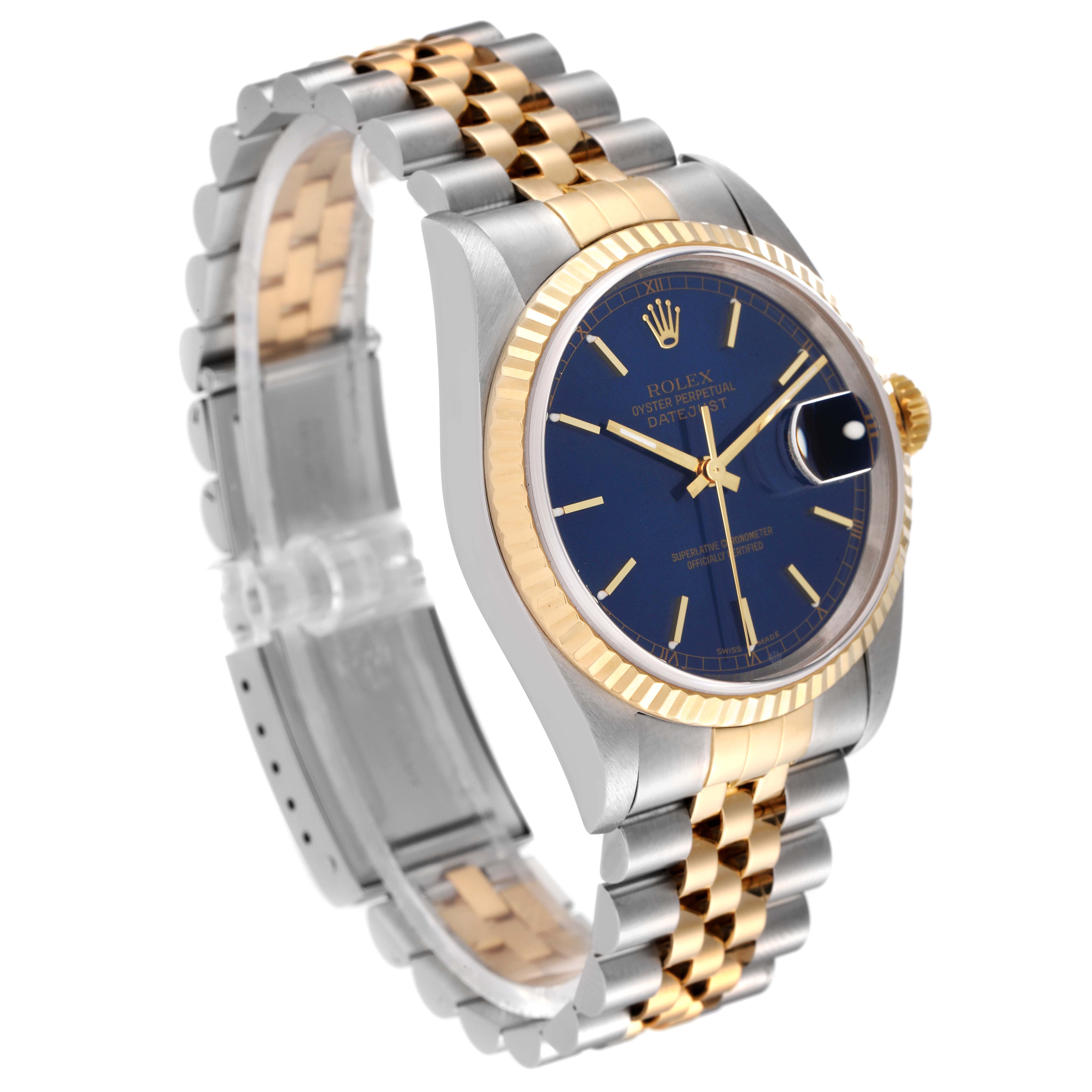 The image shows a Rolex Datejust 16233 Men's Steel and Gold (two tone) Blue Dial 16233 Men's Steel and Gold (two tone) Blue Dial watch at an oblique angle, highlighting its face, bezel, and two-tone bracelet.