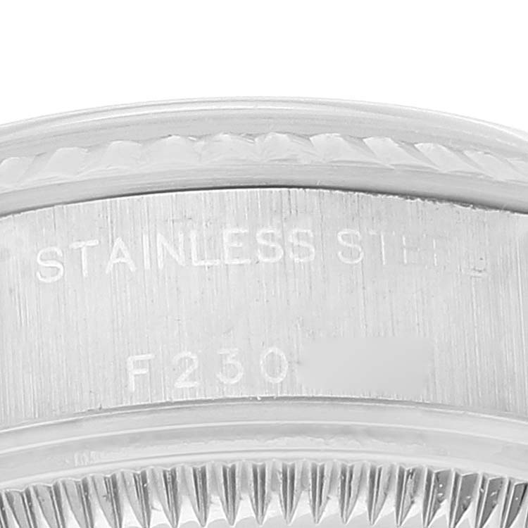 This image shows a close-up of the bezel and the serial number engraving on the Rolex Datejust 79174 Women's Stainless Steel Black Dial 79174 Women's Stainless Steel Black Dial watch.