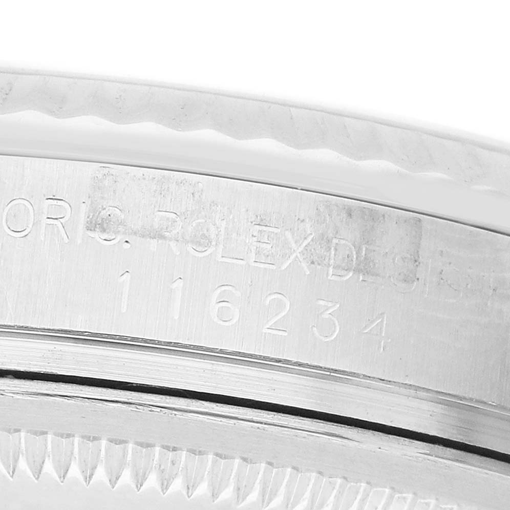 The image shows the serial number and branding on the side of the bezel and case of a Rolex Datejust 116234 Men's Stainless Steel Silver Dial watch.