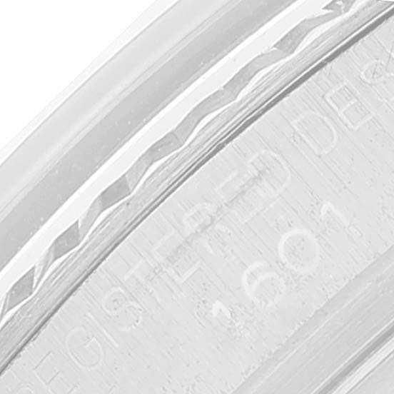 This image shows a close-up angle of the engraving on the bezel and case back of a Rolex Datejust 1601 Men
s Stainless Steel Silver Dial 1601 Men
s Stainless Steel Silver Dial model.